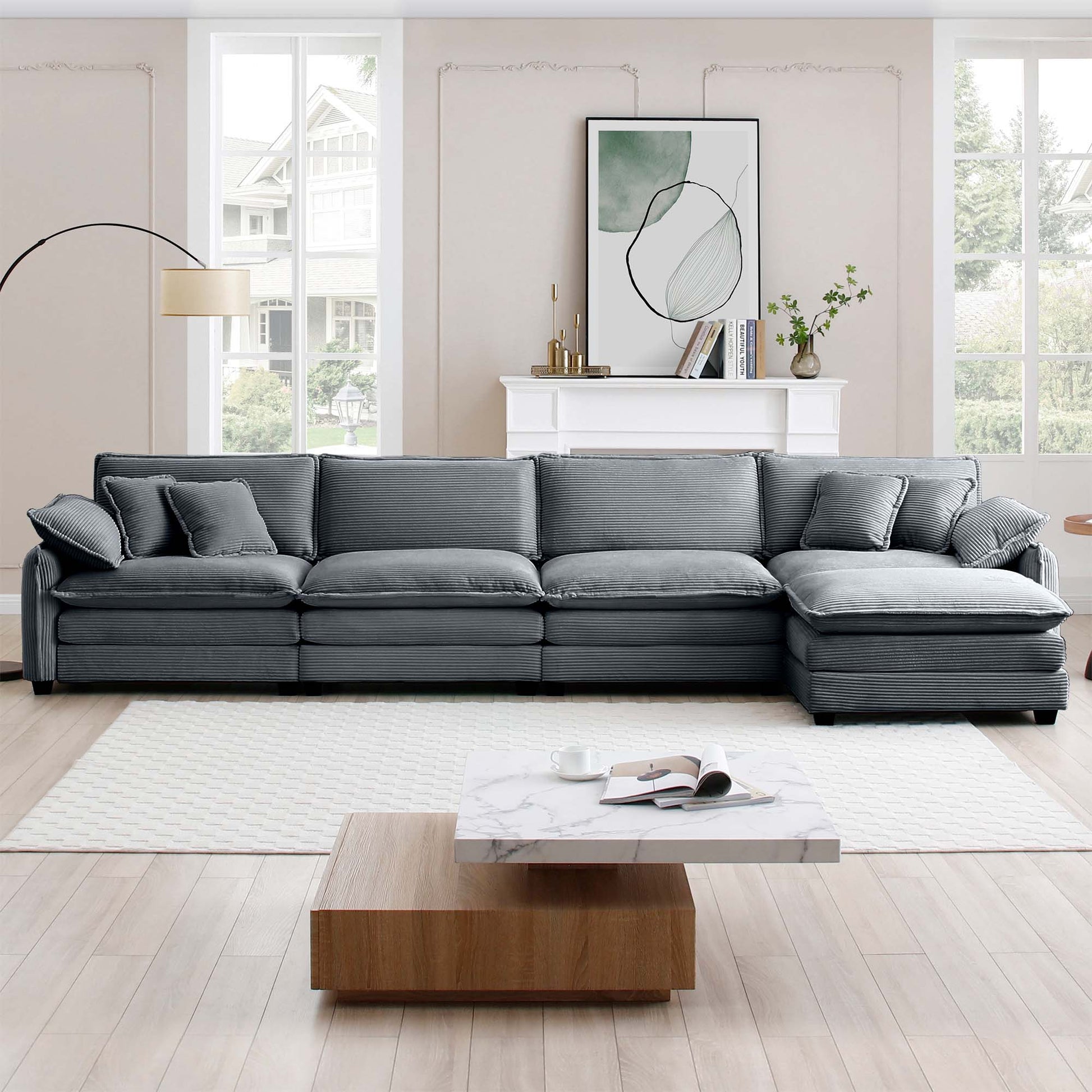 Deep grey corduroy sectional sofa with plush cushions and matching throw pillows