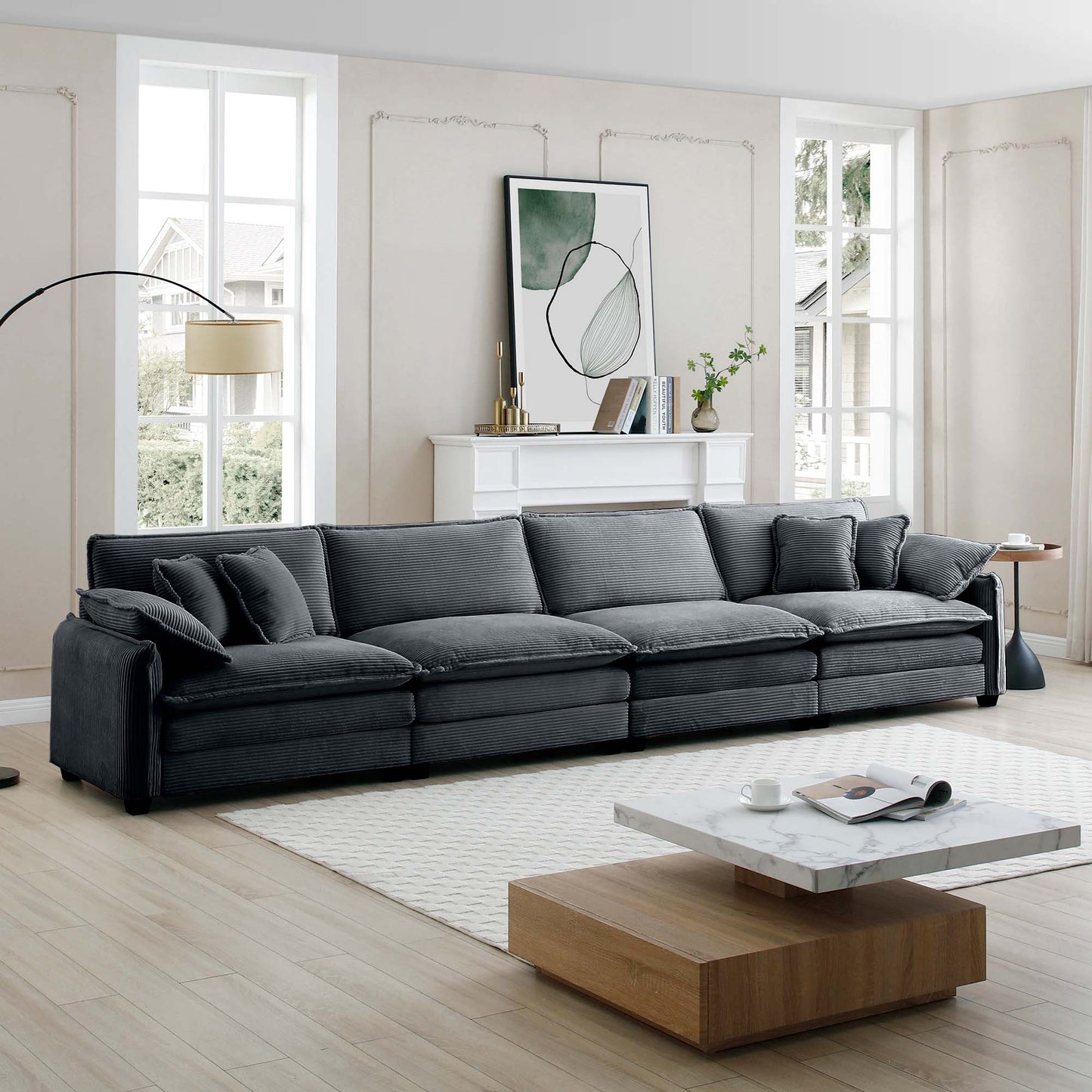 Deep charcoal corduroy sectional sofa with plush cushions in a modern living room