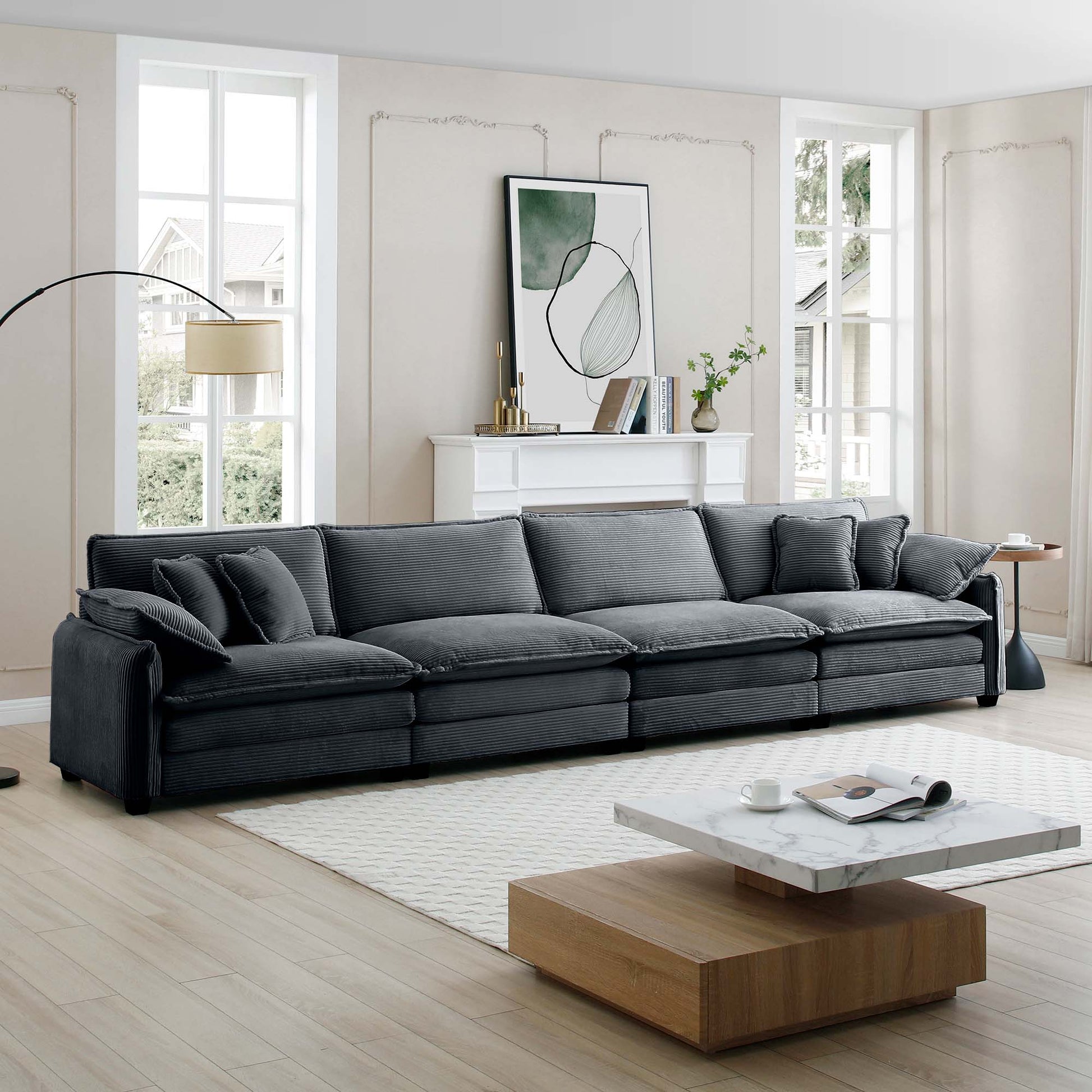 Deep charcoal corduroy sectional sofa with plush cushions in a modern living room