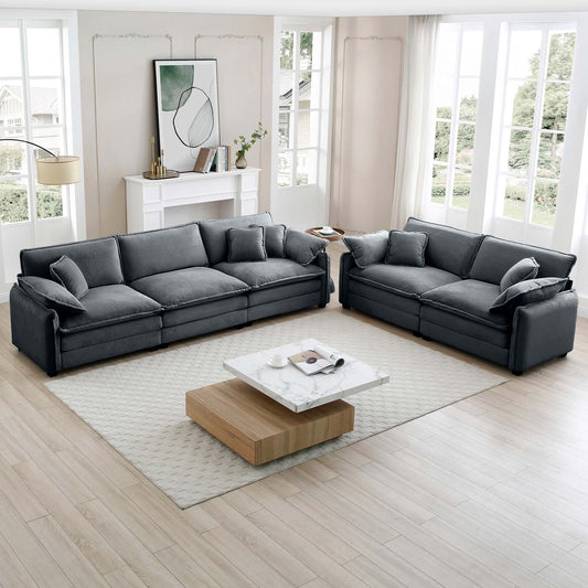 Dark gray corduroy sectional sofa with plush cushions and matching throw pillows