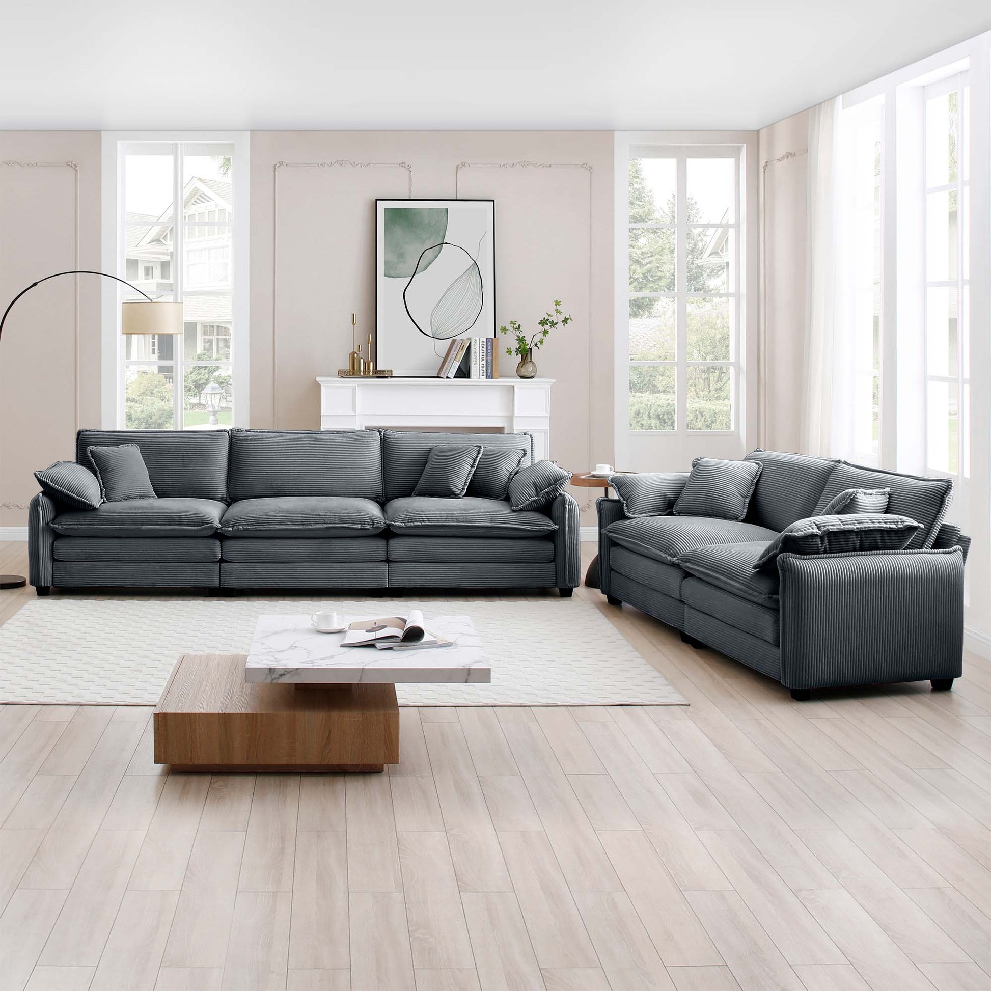 Plush grey corduroy sofa with deep cushions and matching throw pillows modern living room style
