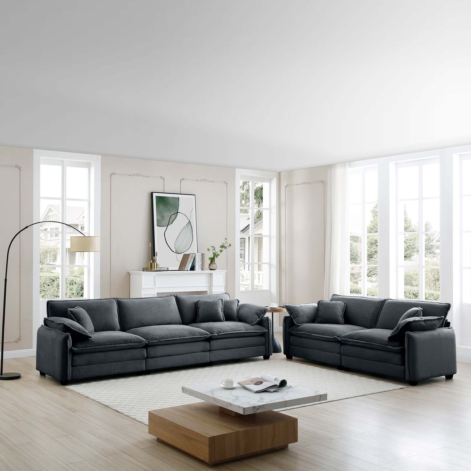 Dark gray corduroy sectional sofa with plush cushions in a modern living room