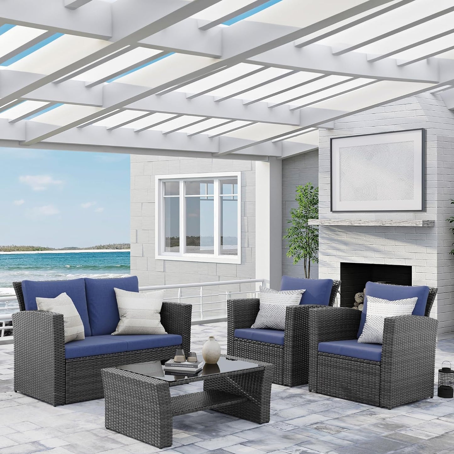 Dark grey wicker patio set with blue cushions for outdoor relaxation