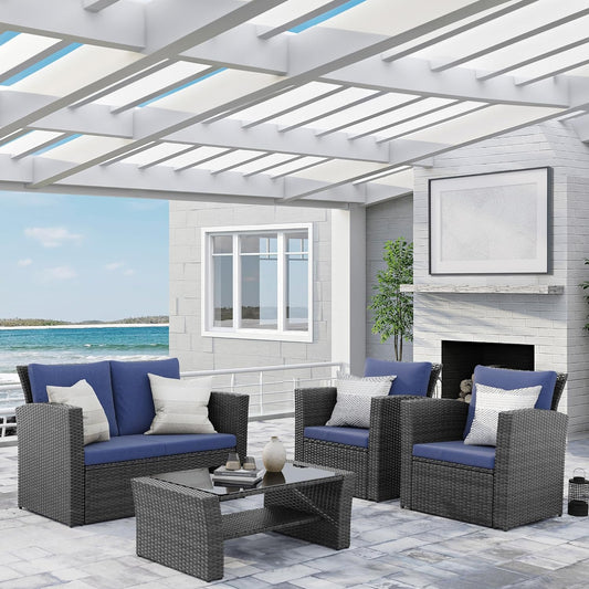 Dark grey wicker patio set with blue cushions for outdoor relaxation