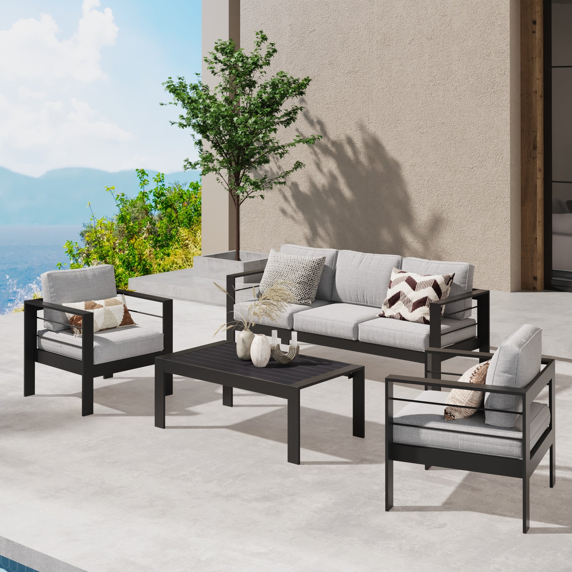 Modern gray outdoor sofa set with black metal frame and geometric pillows for patio decor