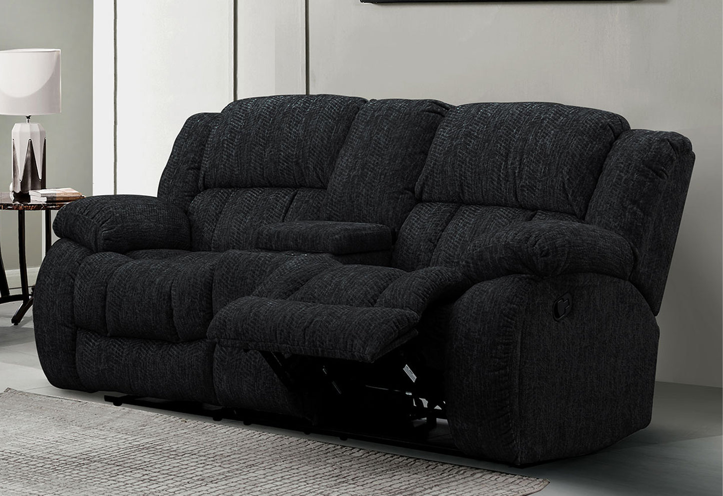 Charcoal gray reclining sofa with plush cushions and chevron texture fabric