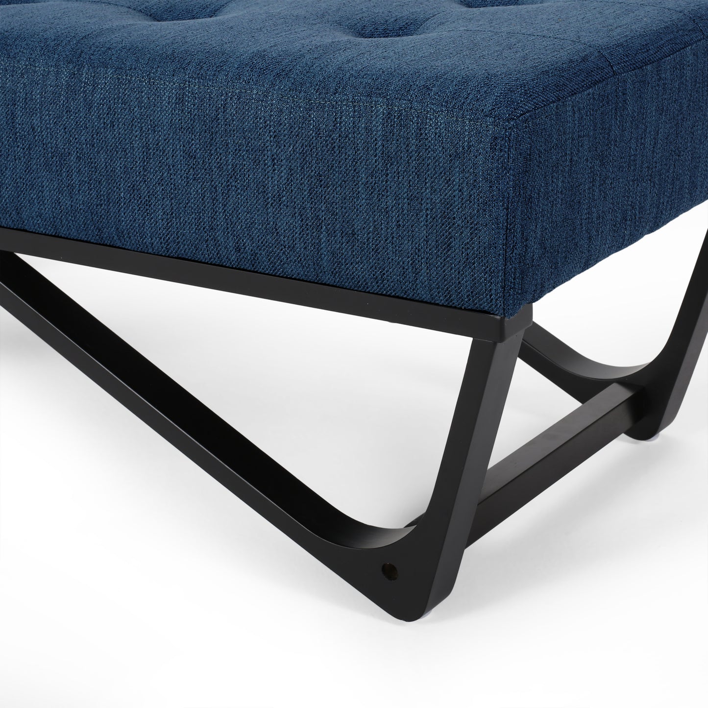 Deep blue tufted ottoman with modern black metal legs
