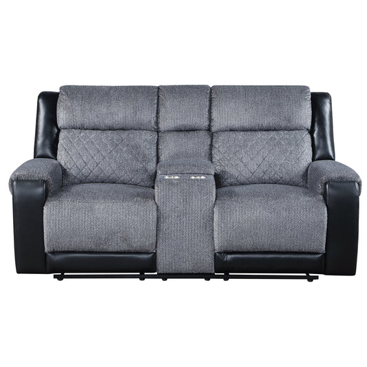 Gray upholstered recliner sofa with black leather accents and diamond stitching featuring a center console