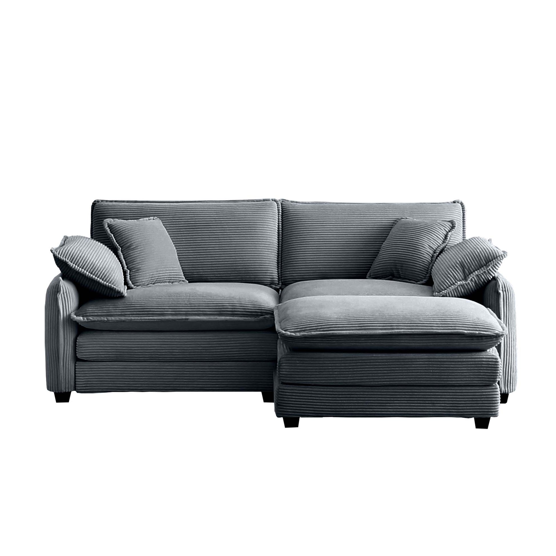 Dark gray corduroy sectional sofa with plush cushions and an ottoman