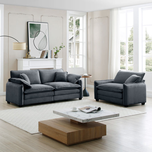Dark grey corduroy sofa with plush cushions and modern design