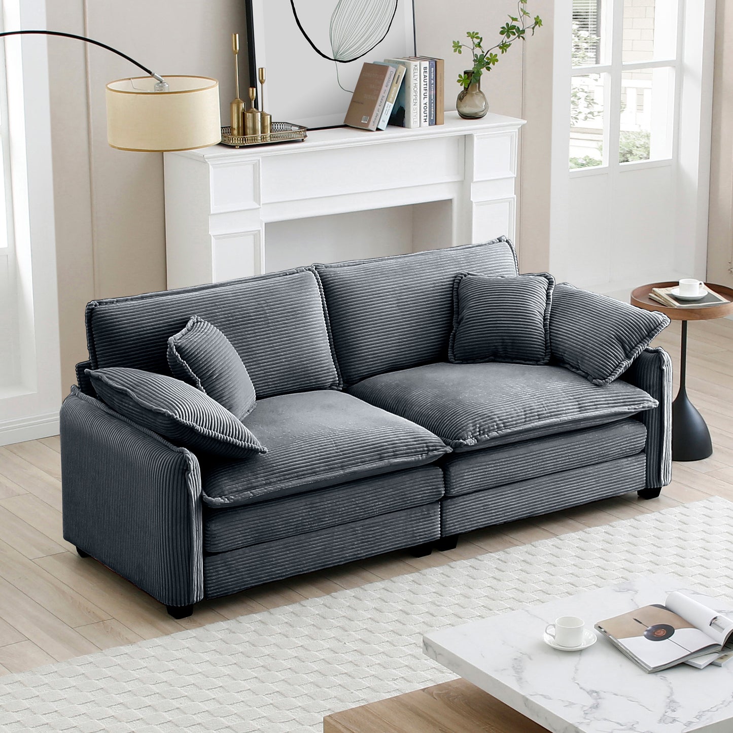 Deep grey corduroy sofa with plush cushions and a modern design
