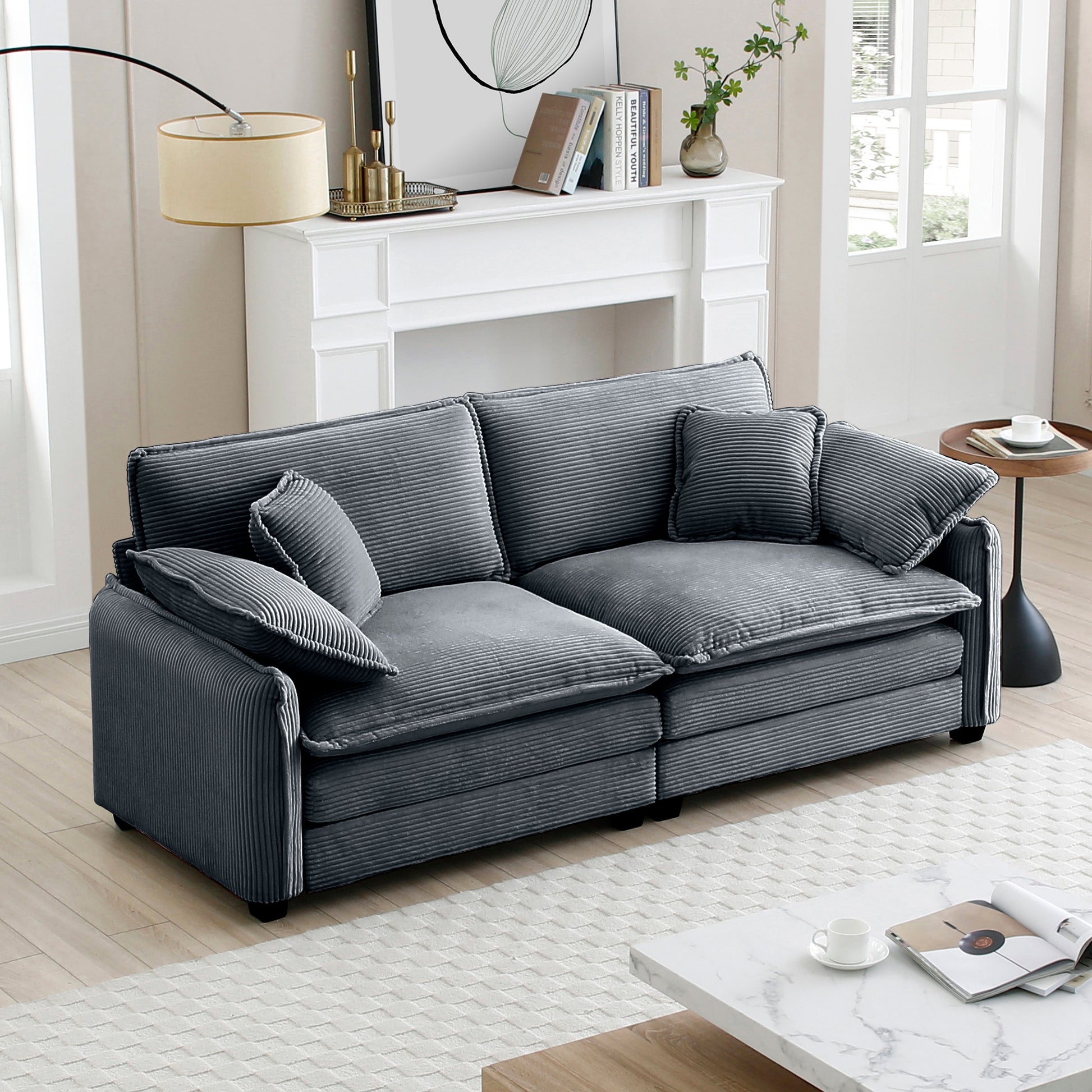 Deep grey corduroy sofa with plush cushions and a modern design