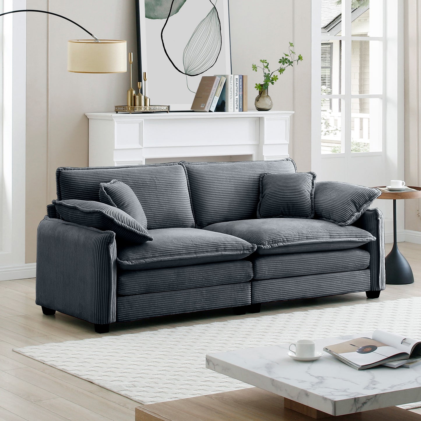 Dark grey corduroy sofa with plush cushions perfect for modern living rooms