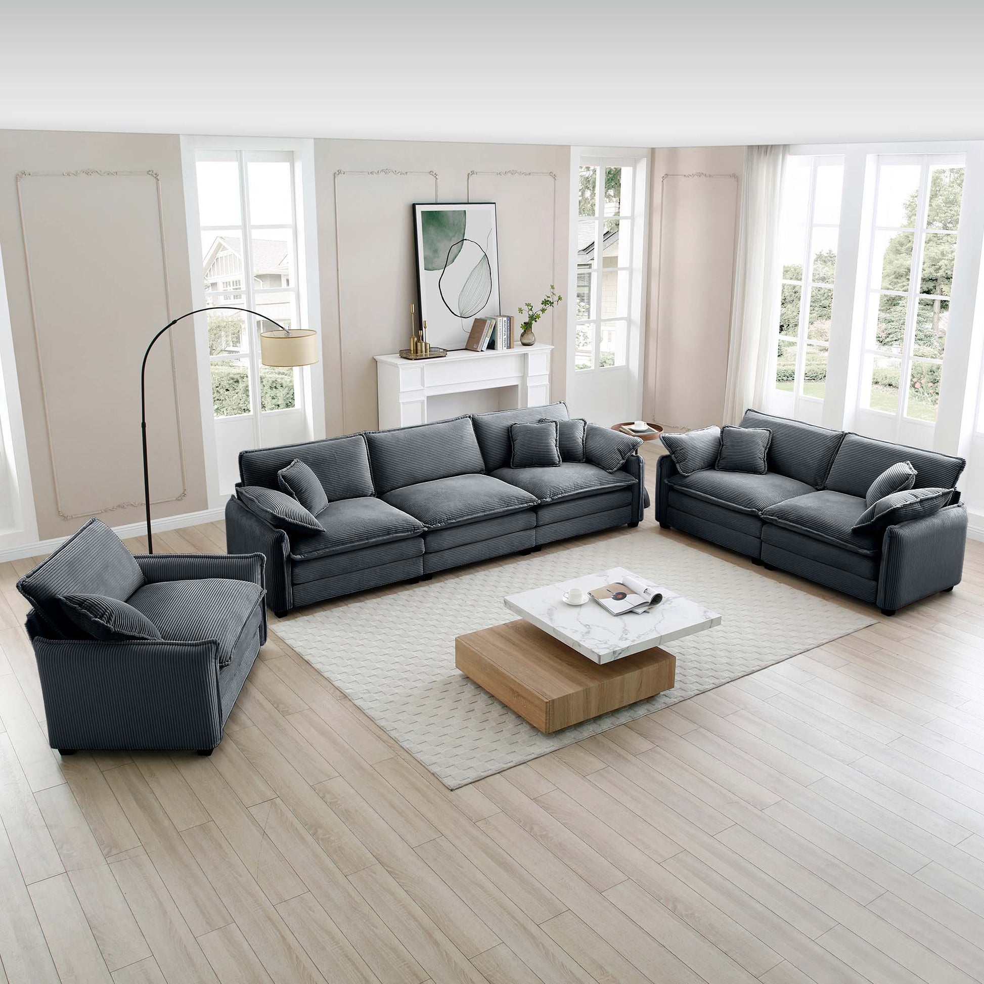 Dark grey corduroy sectional sofa set with plush pillows and a matching armchair