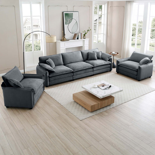 Deep gray corduroy sofa with plush throw pillows perfect for a modern living room