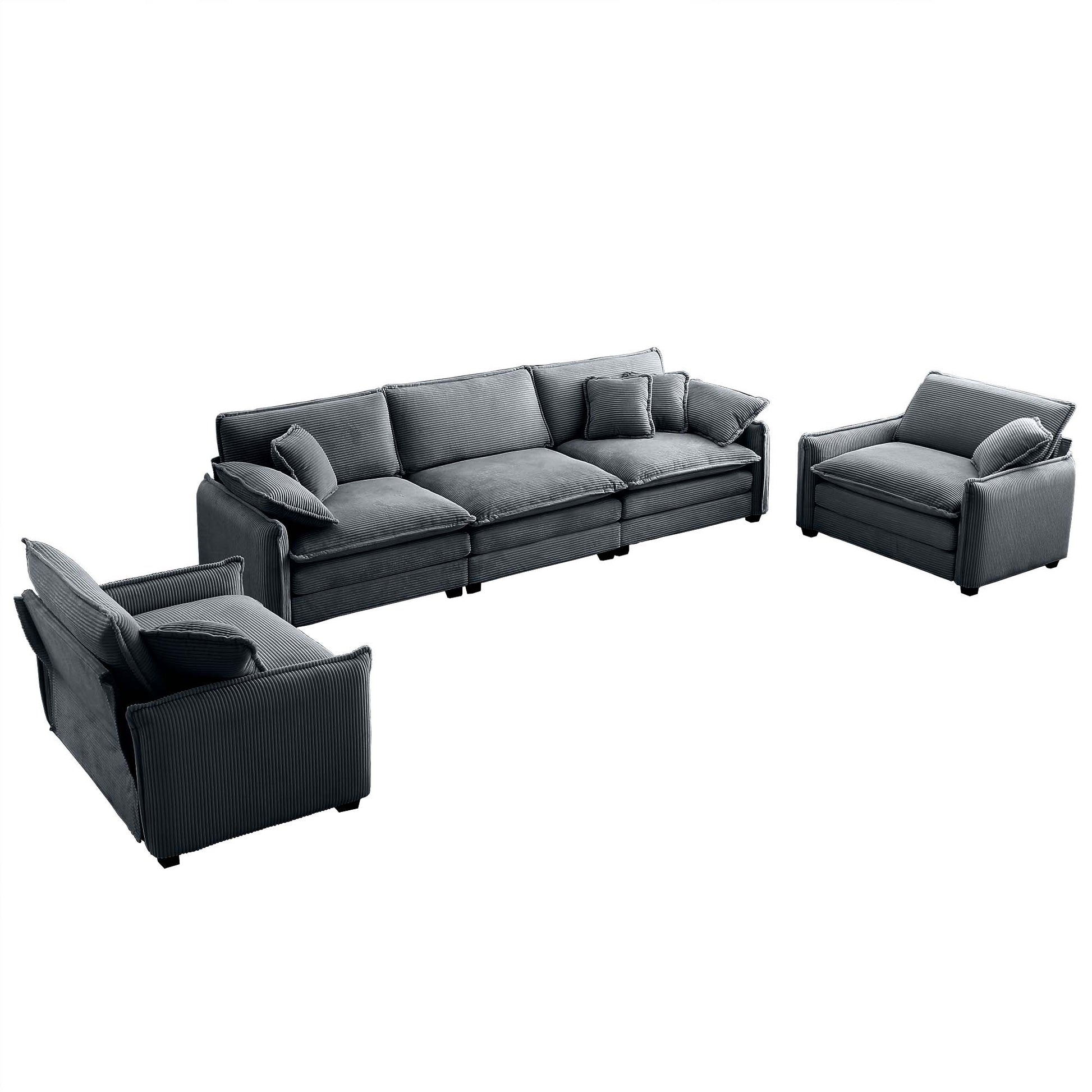 Dark grey corduroy sofa and two matching armchairs with plush cushions