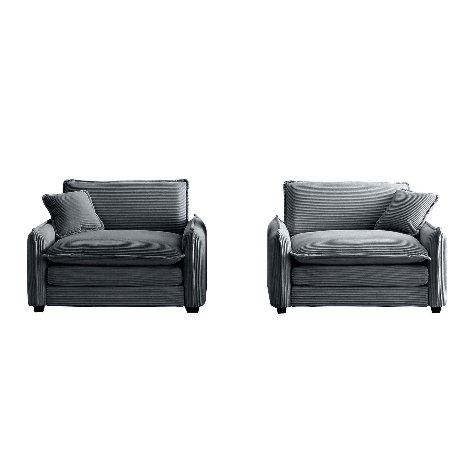Two modern grey corduroy armchairs with plush cushions and a matching throw pillow for cozy seating