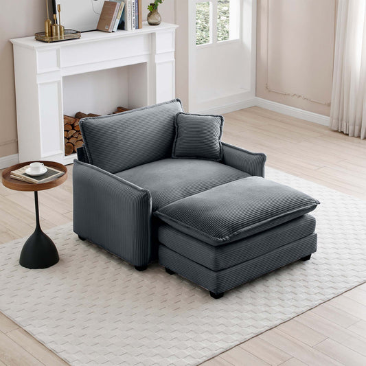 Cozy grey corduroy accent chair with matching ottoman and throw pillow perfect for a living room