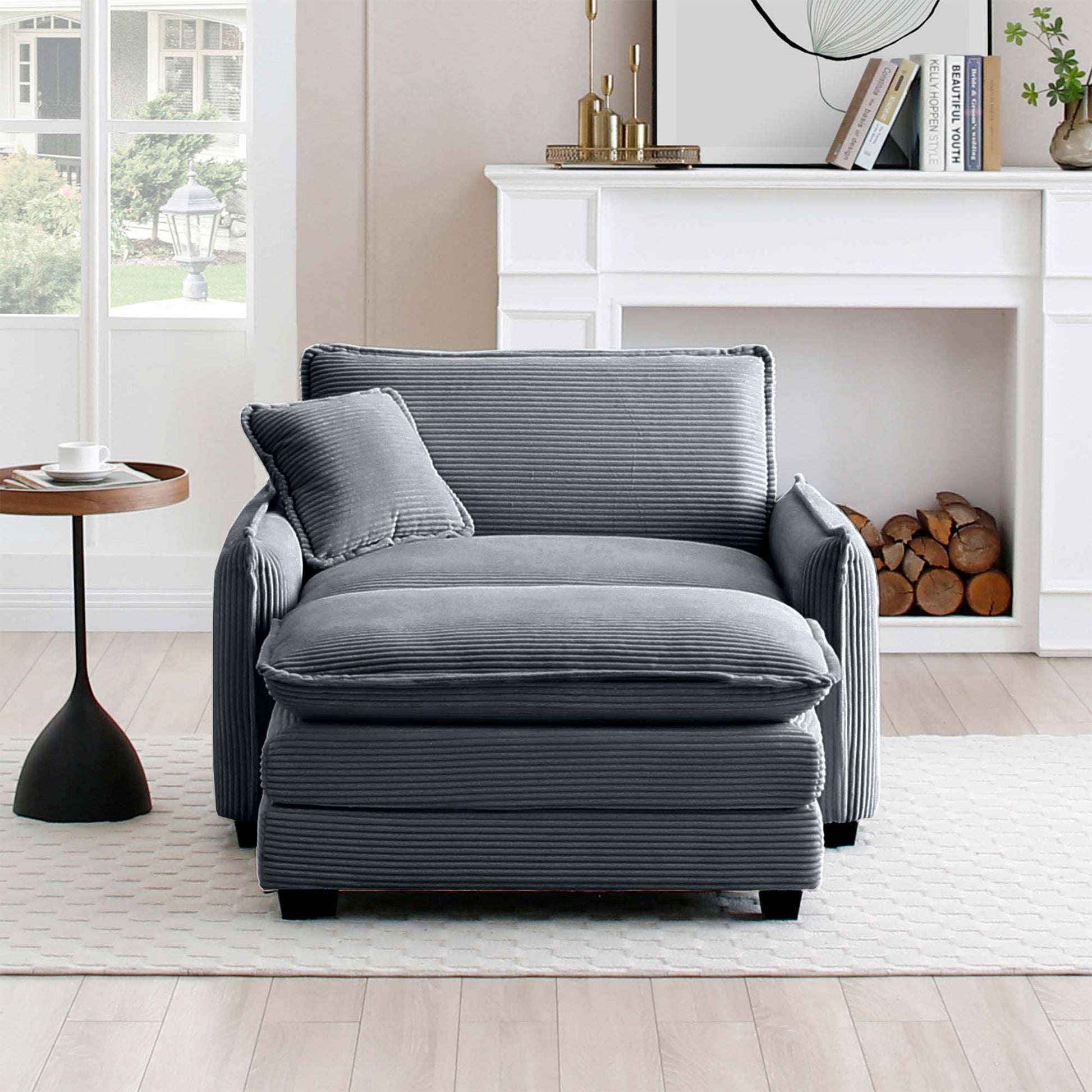 Gray corduroy accent chair with ottoman and throw pillow