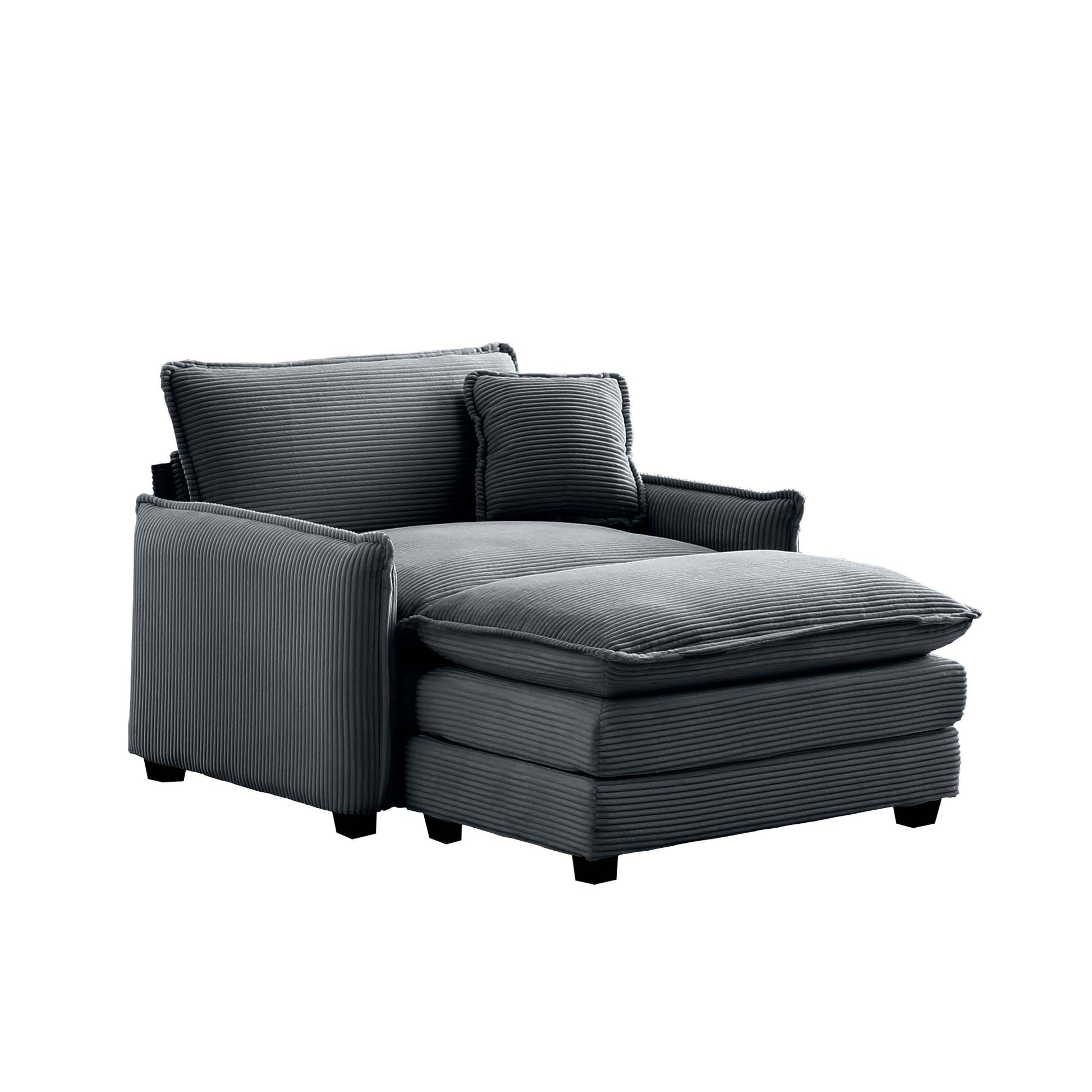 Dark gray corduroy chaise lounge with plush cushions and a matching accent pillow