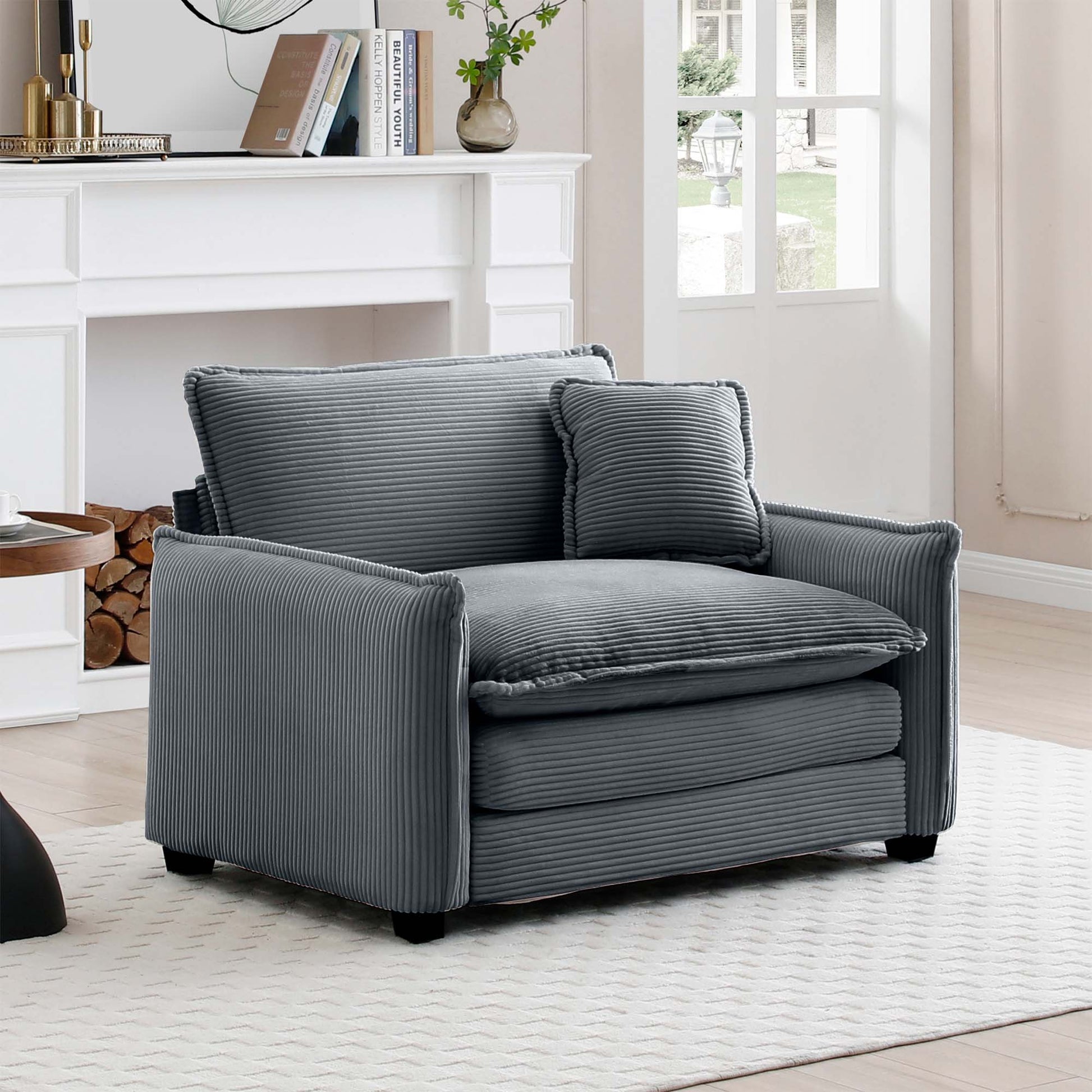 Plush gray corduroy armchair with a matching accent pillow perfect for cozy living rooms