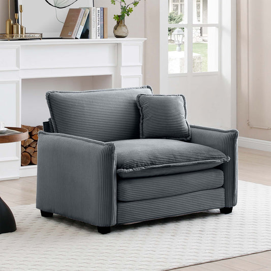 Plush gray corduroy armchair with a matching accent pillow perfect for cozy living rooms
