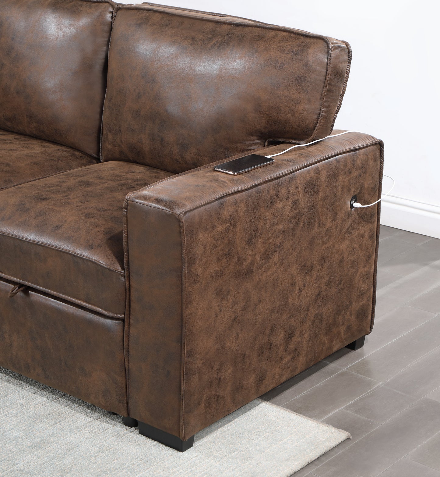 Brown faux leather sofa with builtin USB charging port on armrest