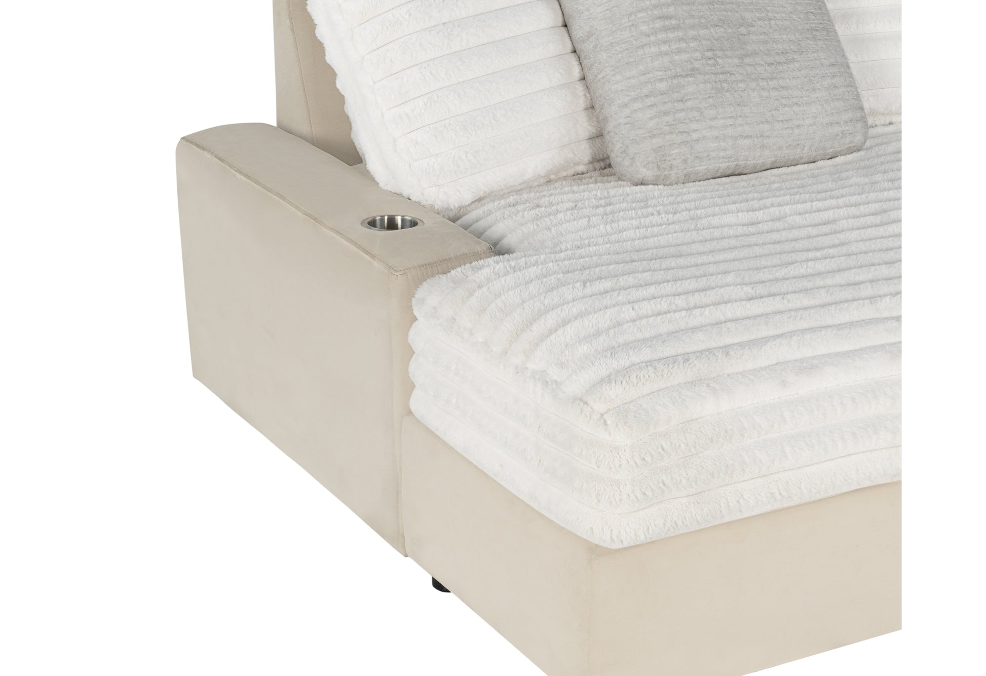 Cream velvet sofa armrest with builtin cup holder and plush white pillows