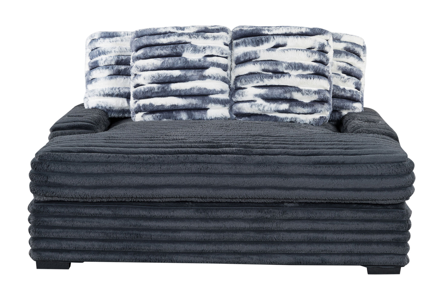 Plush dark grey sectional sofa with four faux fur throw pillows in blue and white tiedye pattern