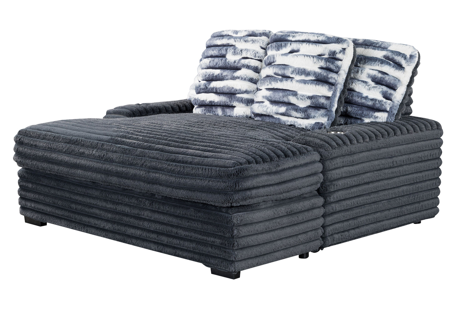 Dark grey corduroy chaise lounge with fluffy patterned pillows for a cozy living room
