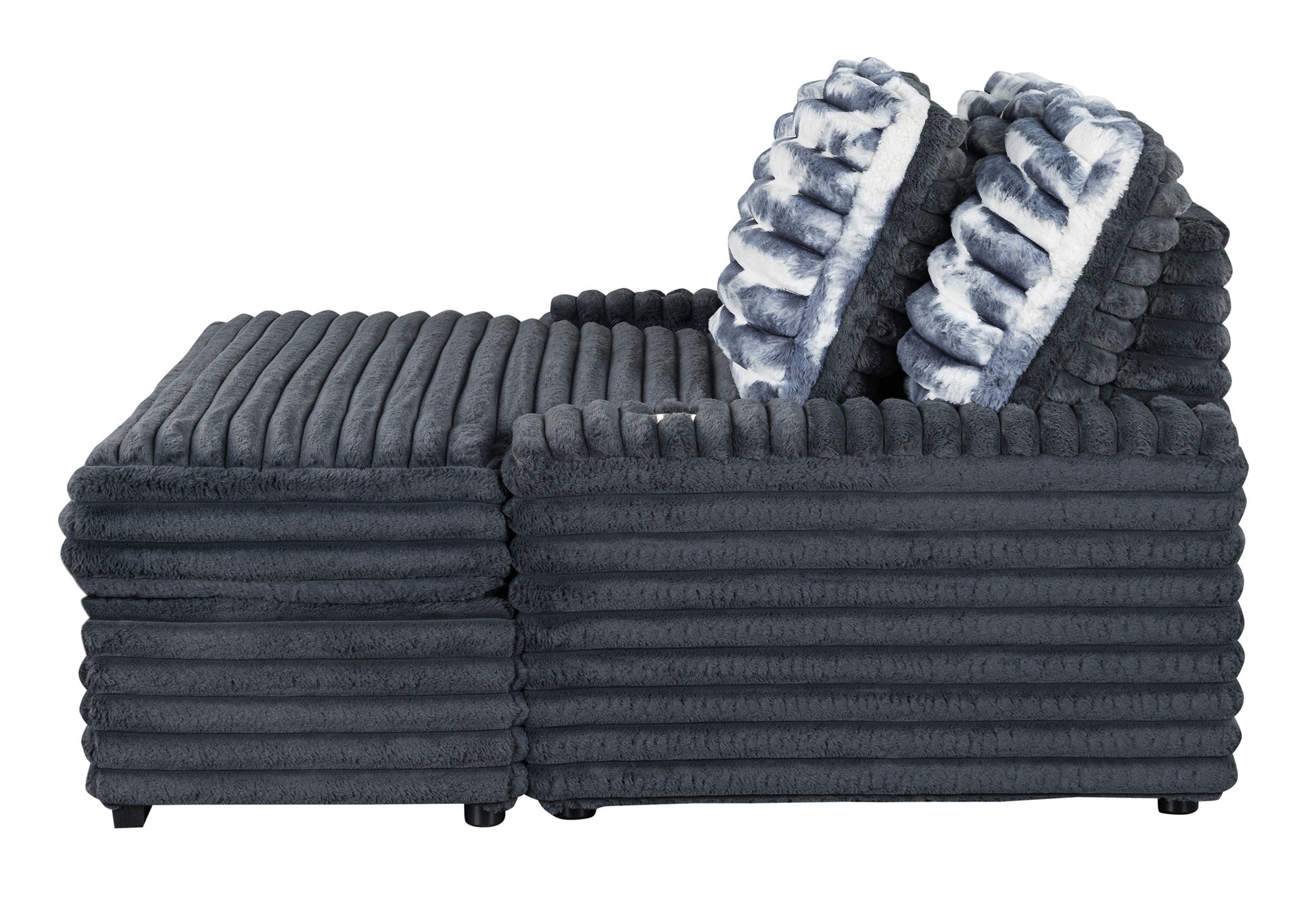 Plush ribbed dark grey sofa with two fluffy grey and white patterned cushions