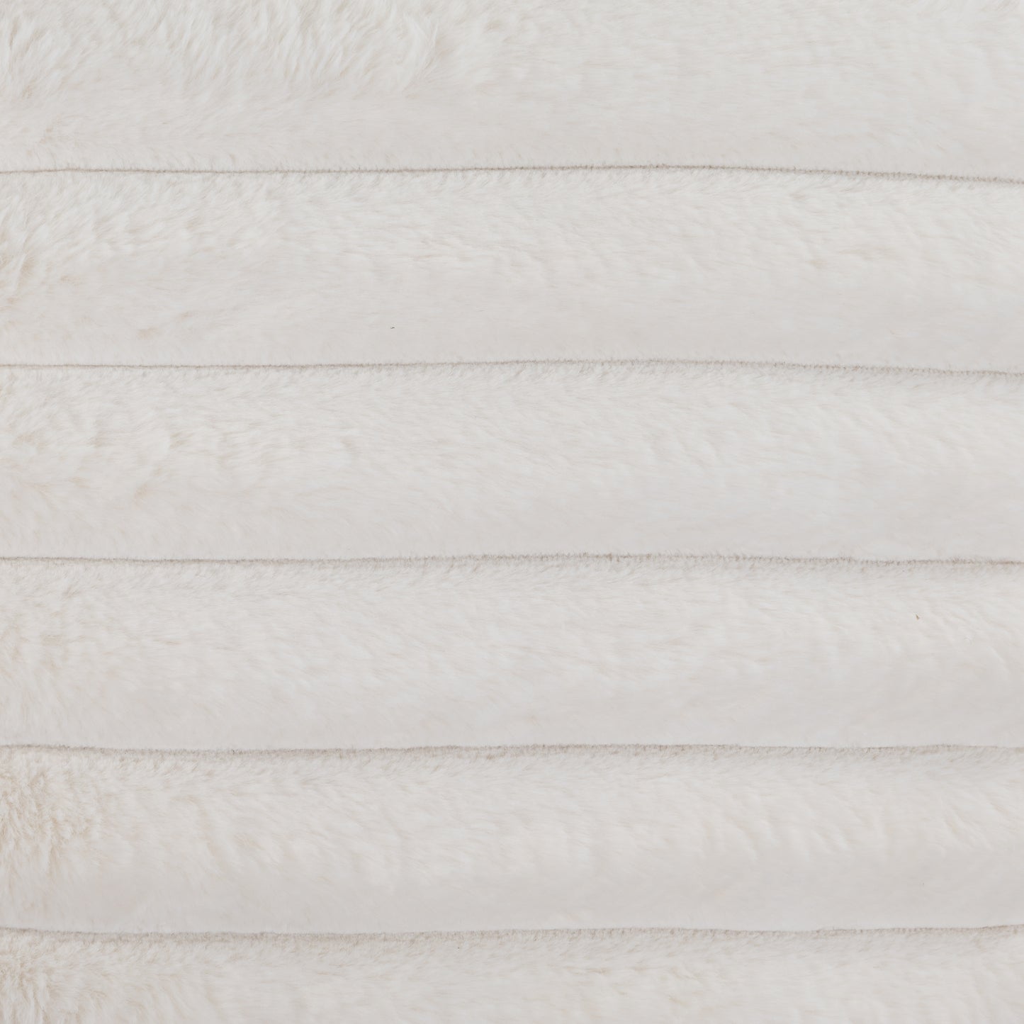 Plush white faux fur fabric with horizontal stitching ideal for blankets and throws