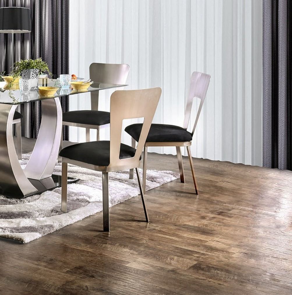 Modern dining chairs with brushed metal frames and black seats for a sleek dining set