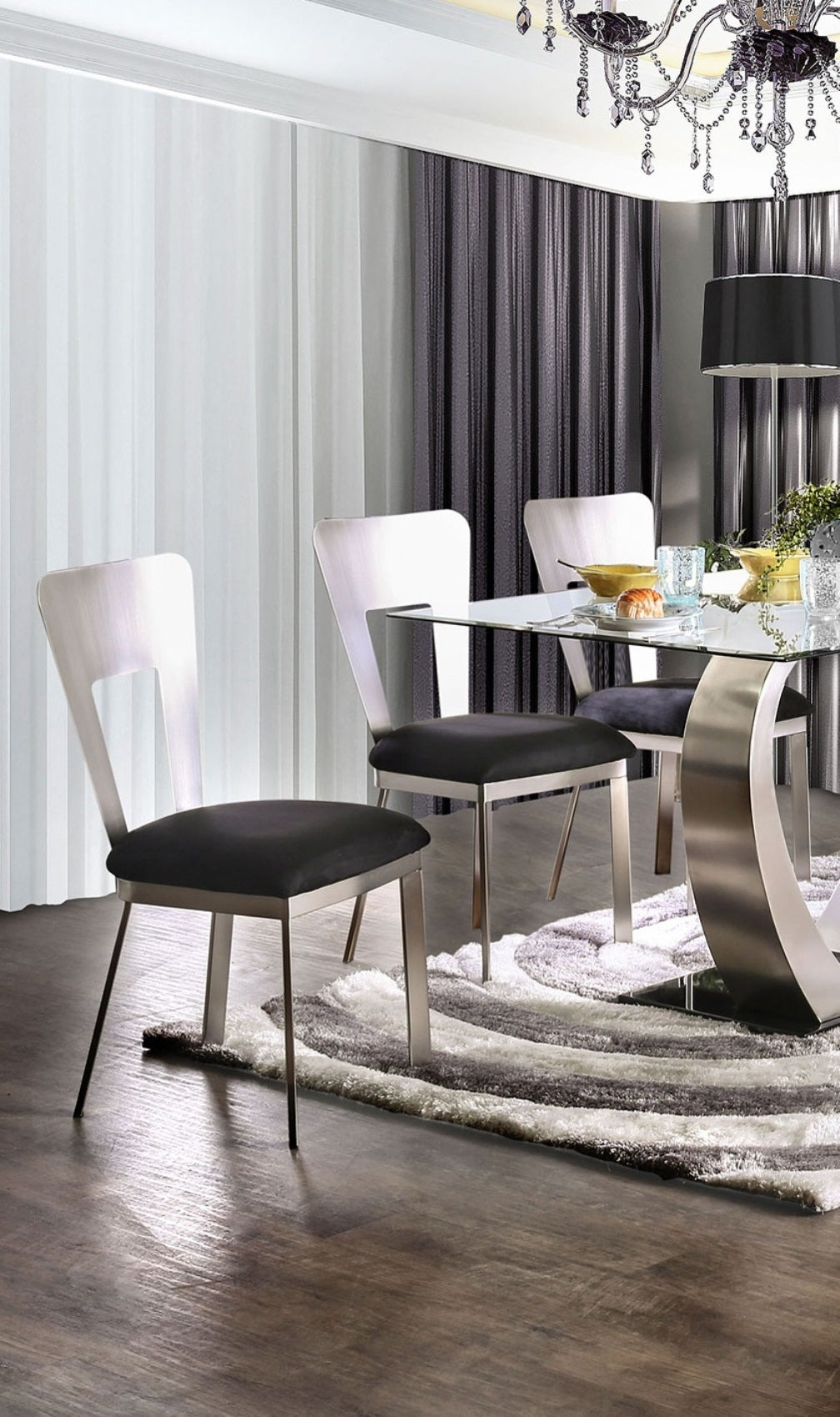 Modern brushed metal dining chair with black upholstered seat sleek and contemporary design