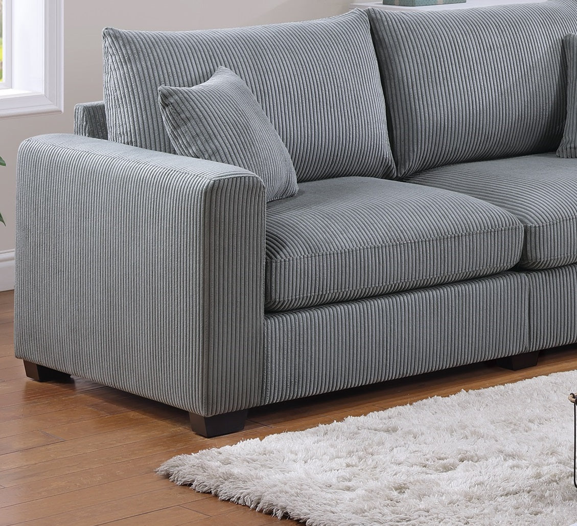 Gray corduroy sofa with plush cushions and a matching throw pillow