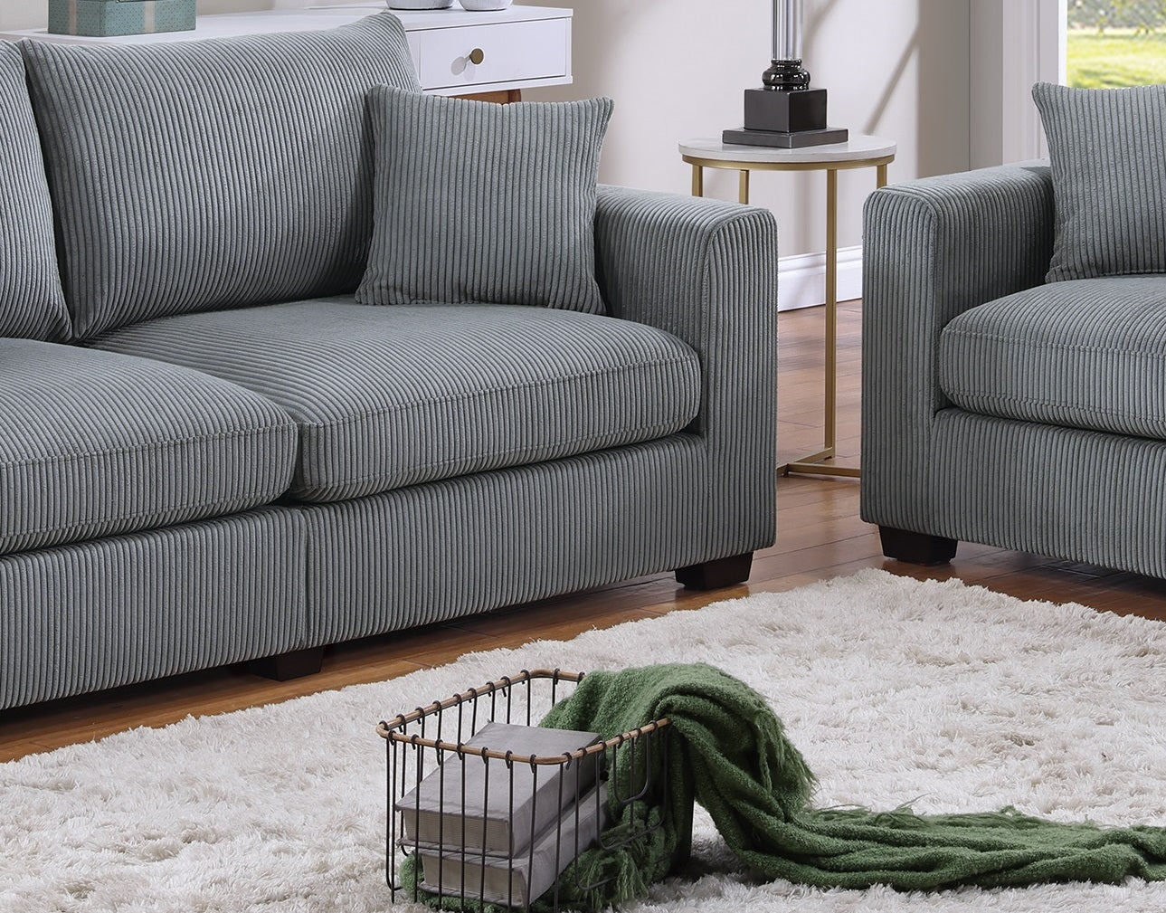 Gray corduroy sofa with plush cushions perfect for living room comfort