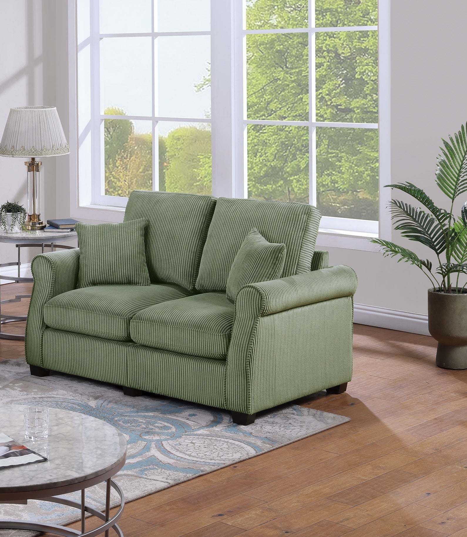 Green corduroy sofa with plush cushions perfect for a cozy living room