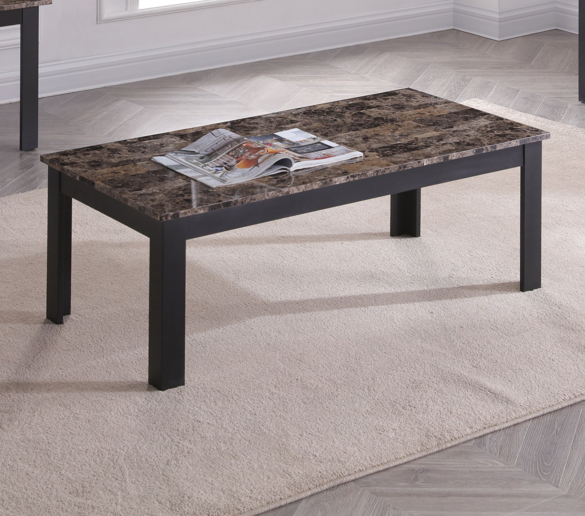 Rectangular coffee table with brown marble top and black legs