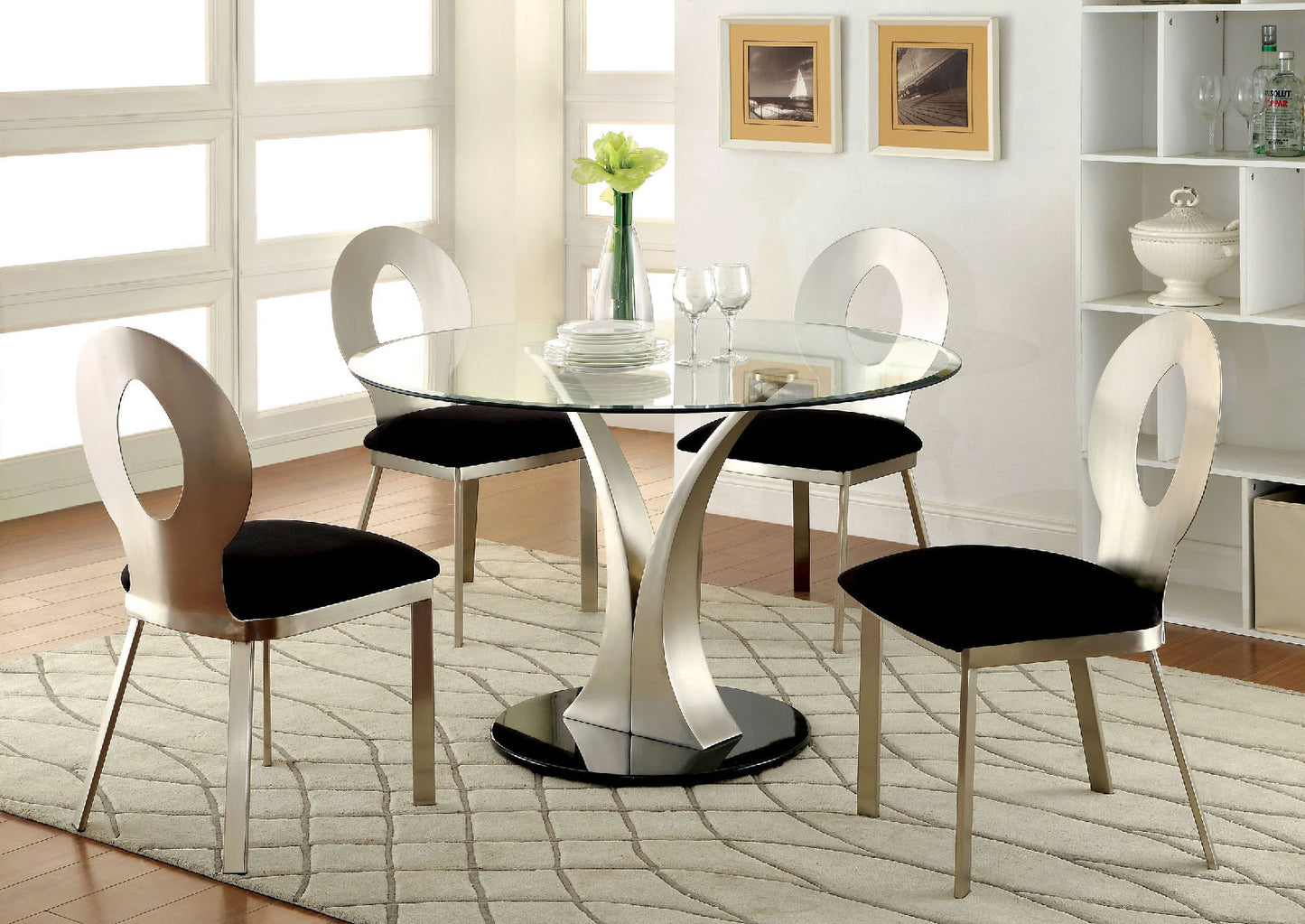 Modern dining set with glass table and four black upholstered chairs