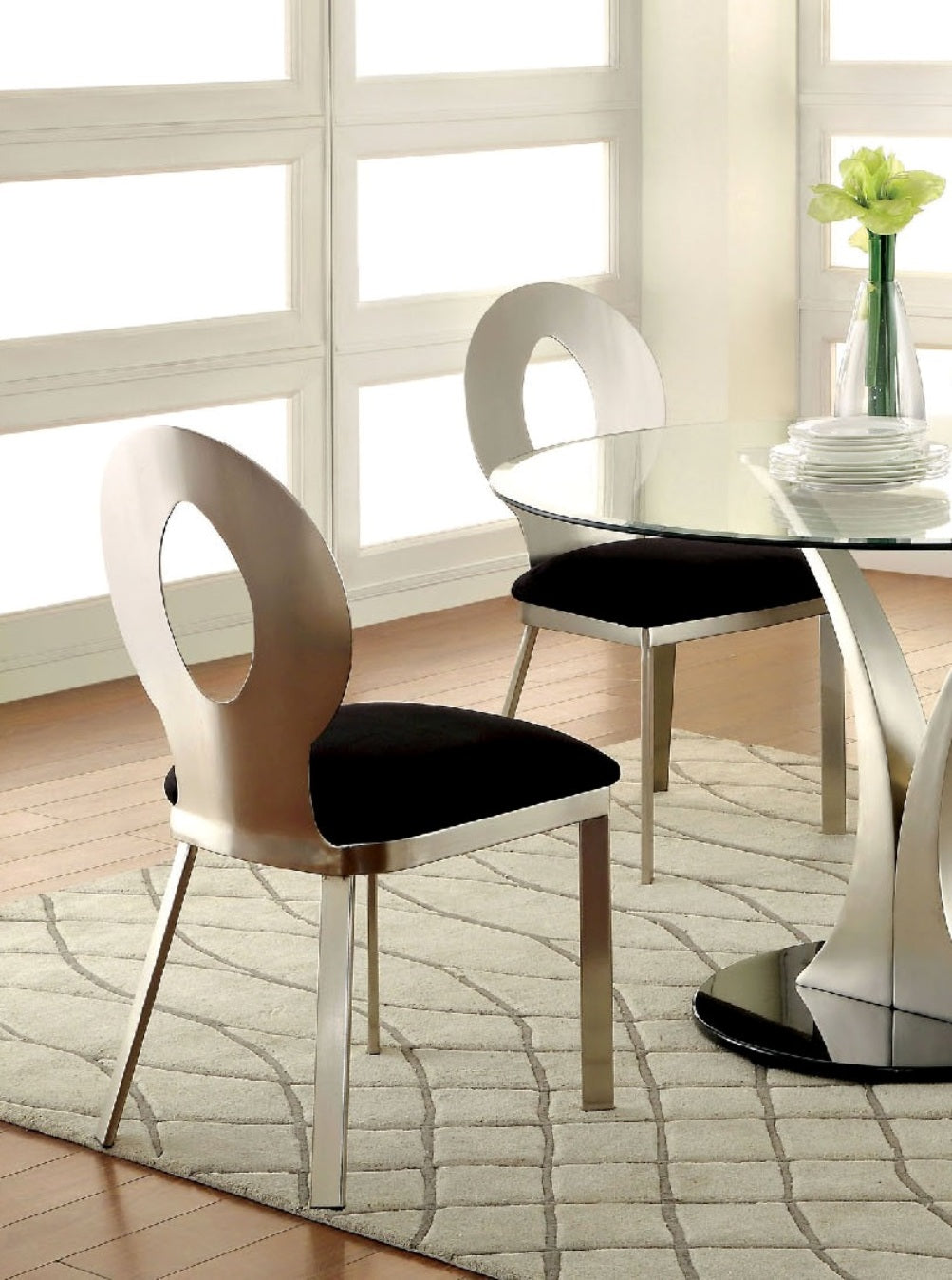 Modern silver dining chair with black upholstered seat and open oval backrest