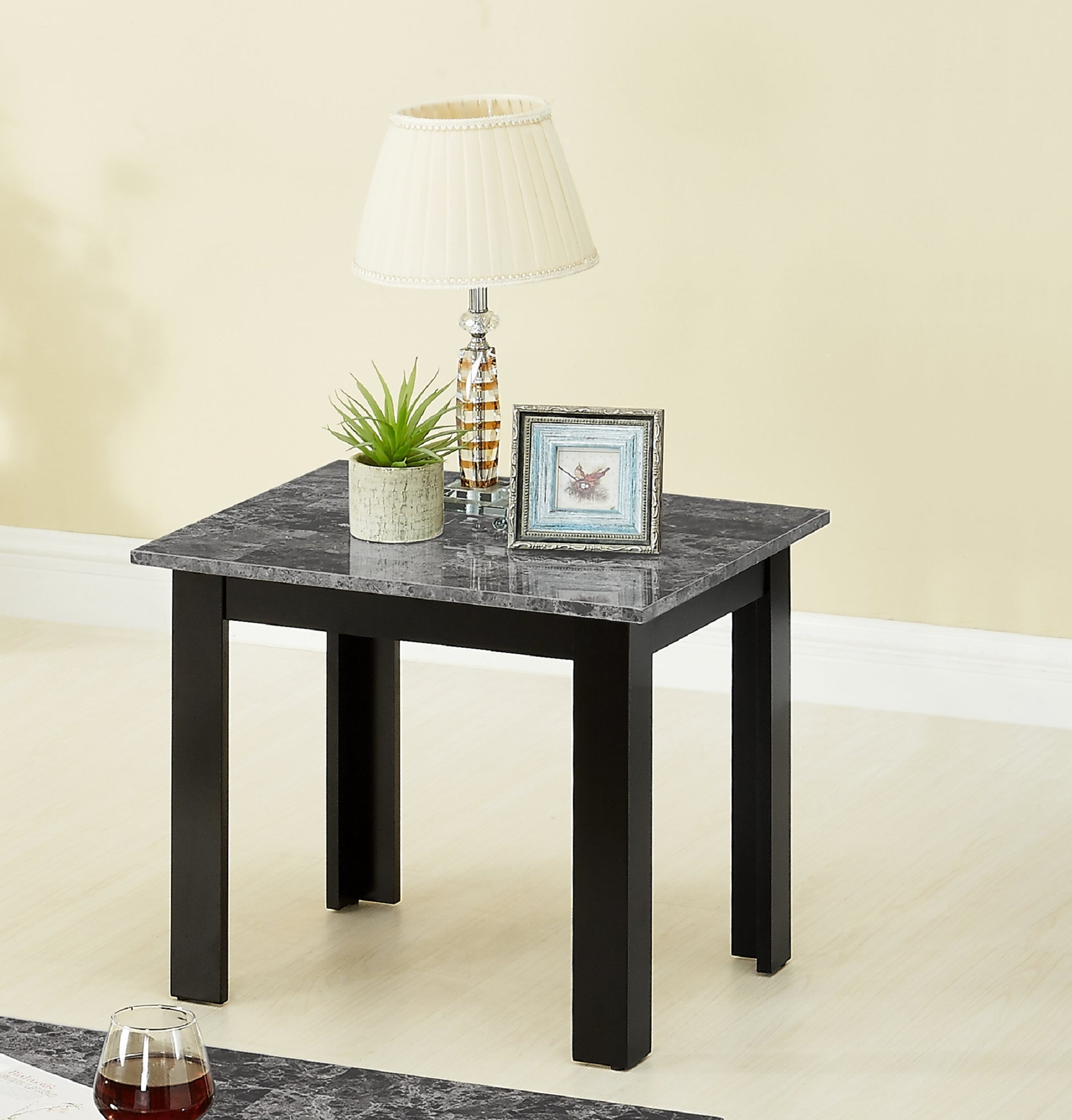 Square marble top side table with black legs perfect for living room decor