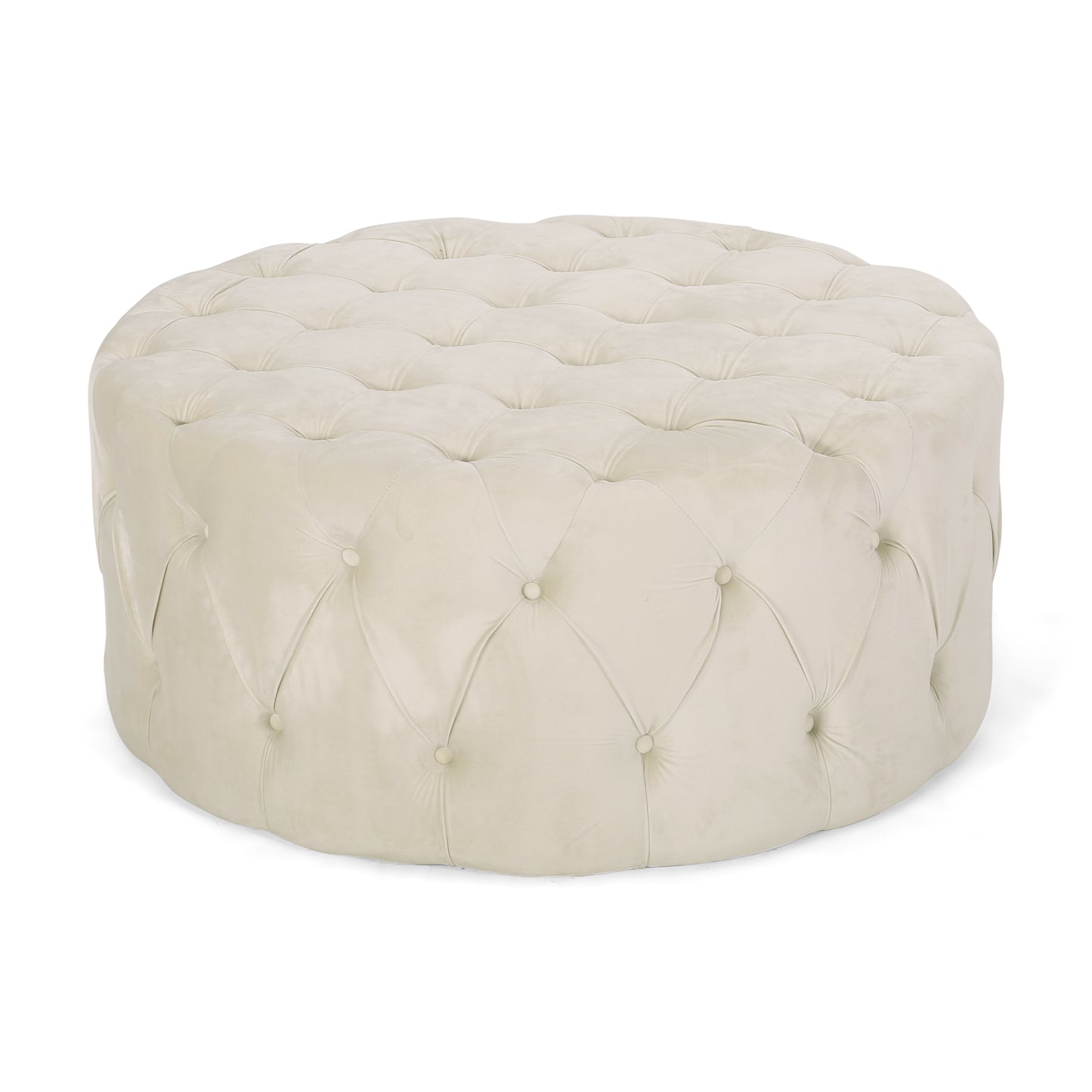 Round beige velvet ottoman with deep button tufting and a plush top surface