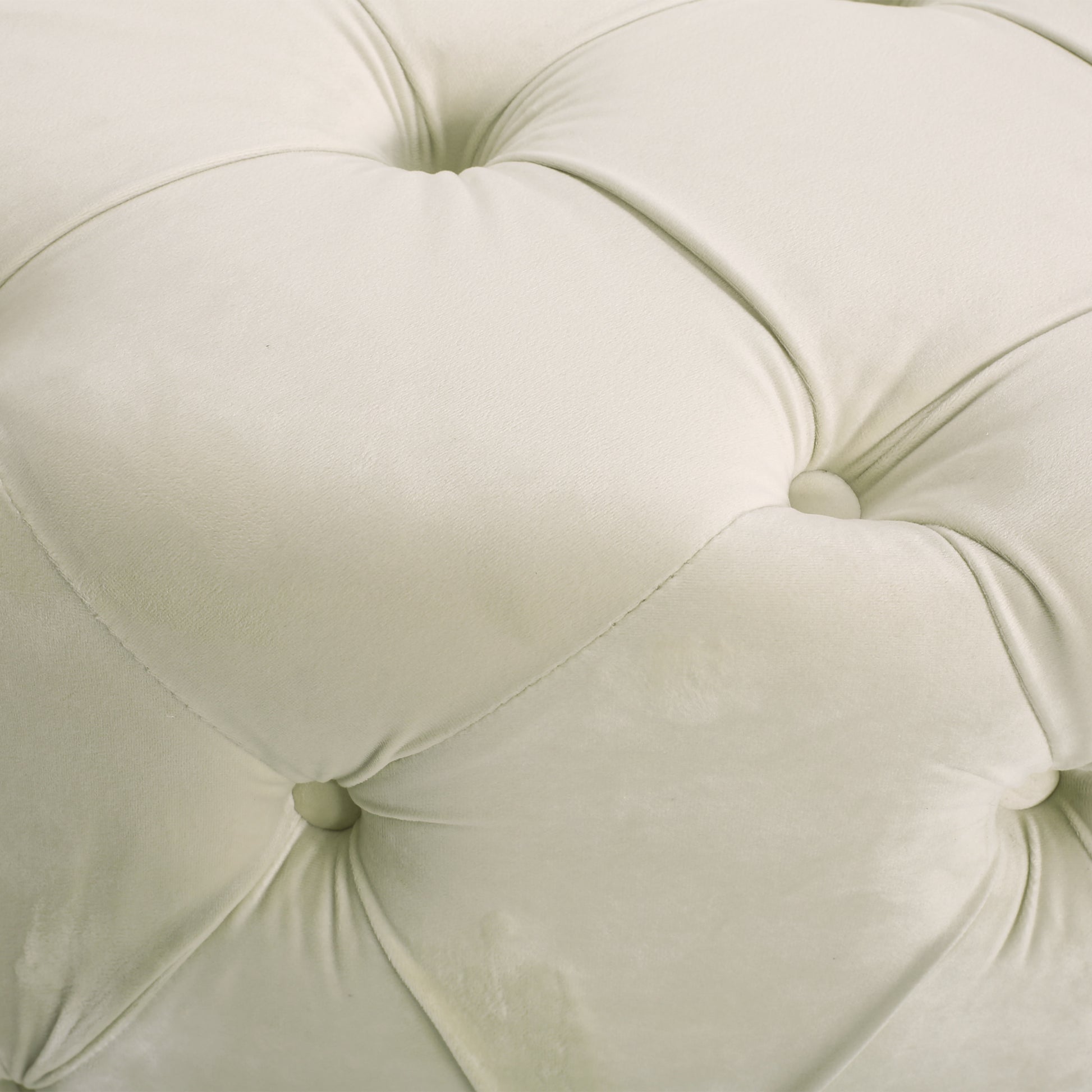 Cream velvet tufted fabric closeup