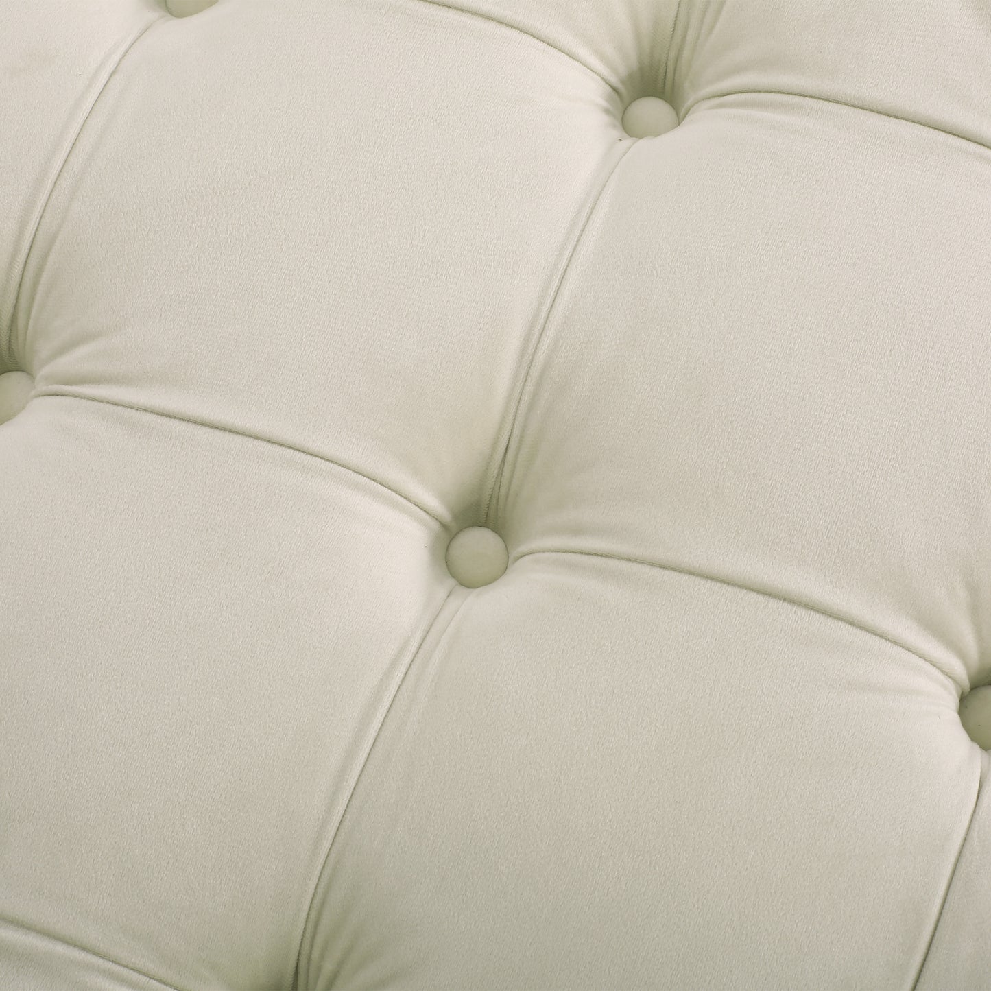 Cream velvet upholstery with deep diamond tufting