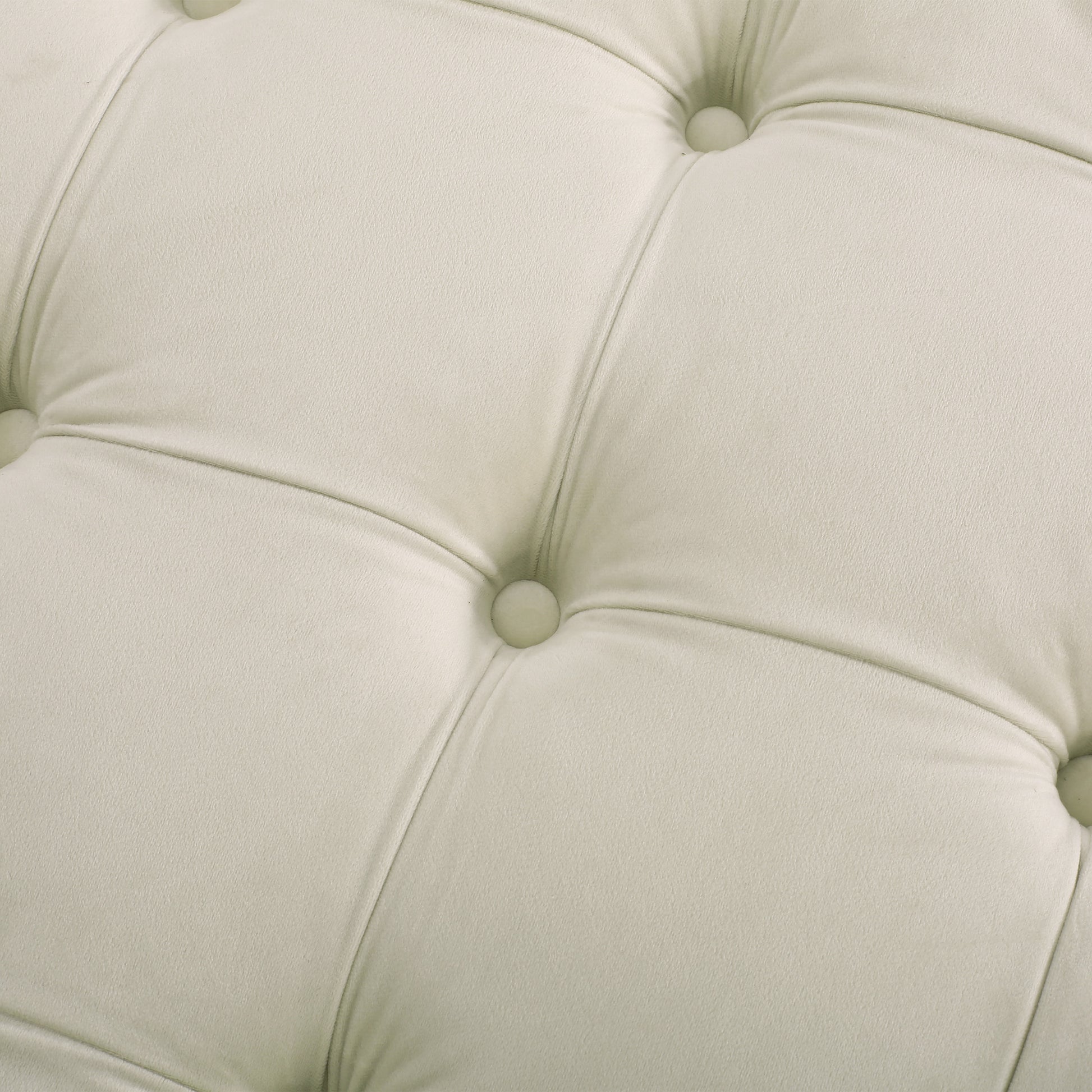 Cream velvet upholstery with deep diamond tufting