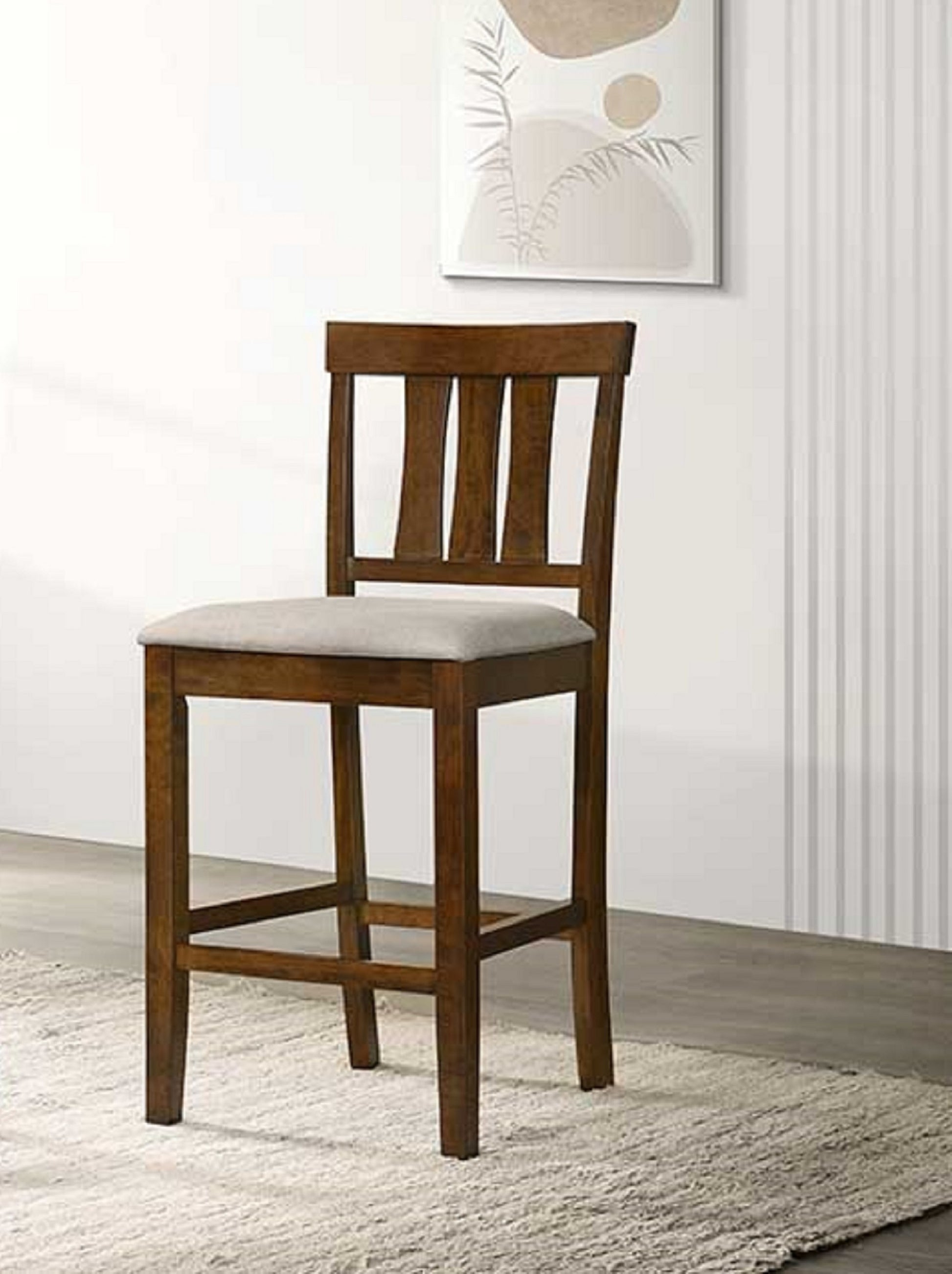Dark wood counter height stool with upholstered light grey seat and vertical slat back