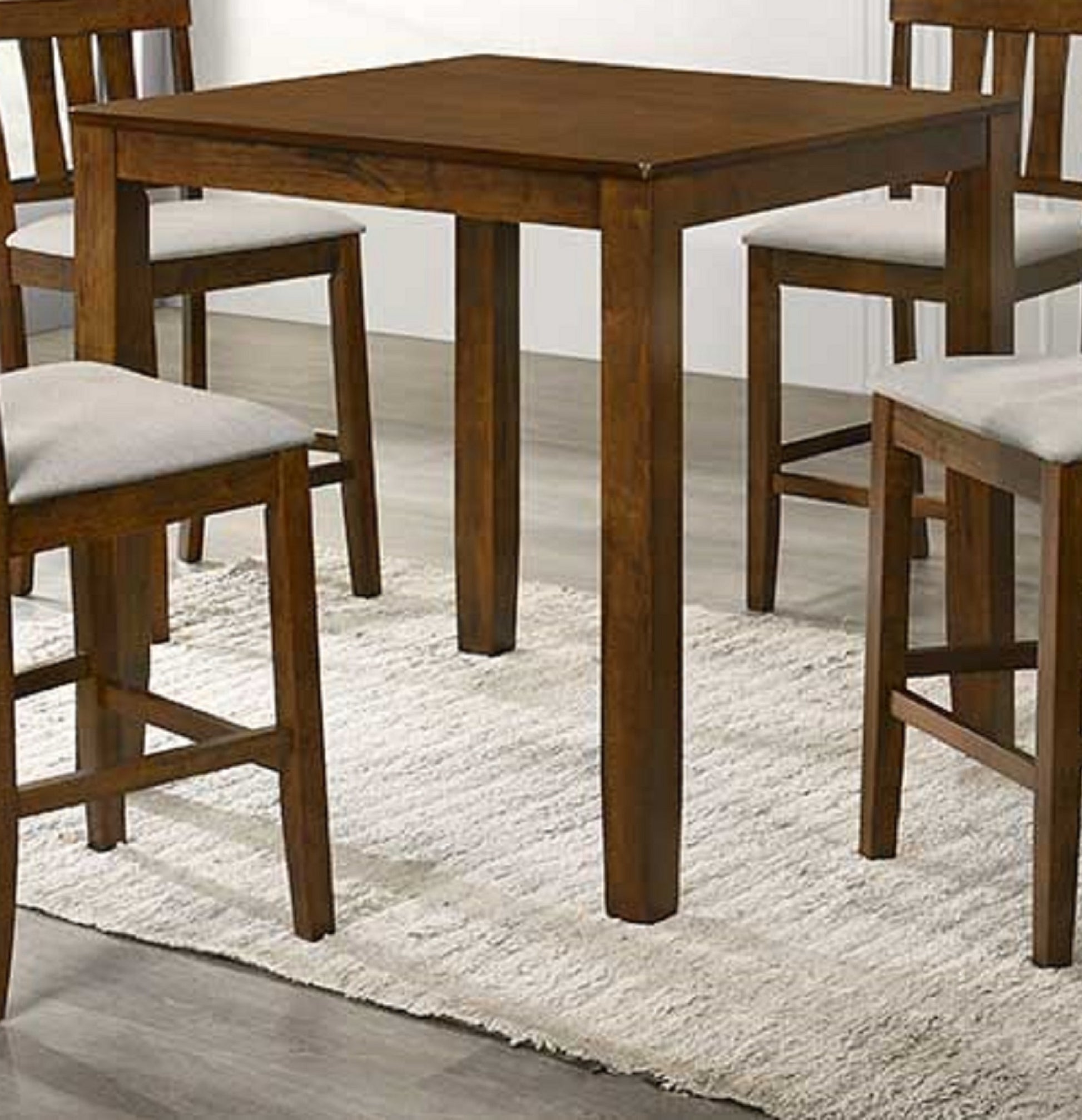 Dark wood bar table with four cushioned stools for a modern kitchen space