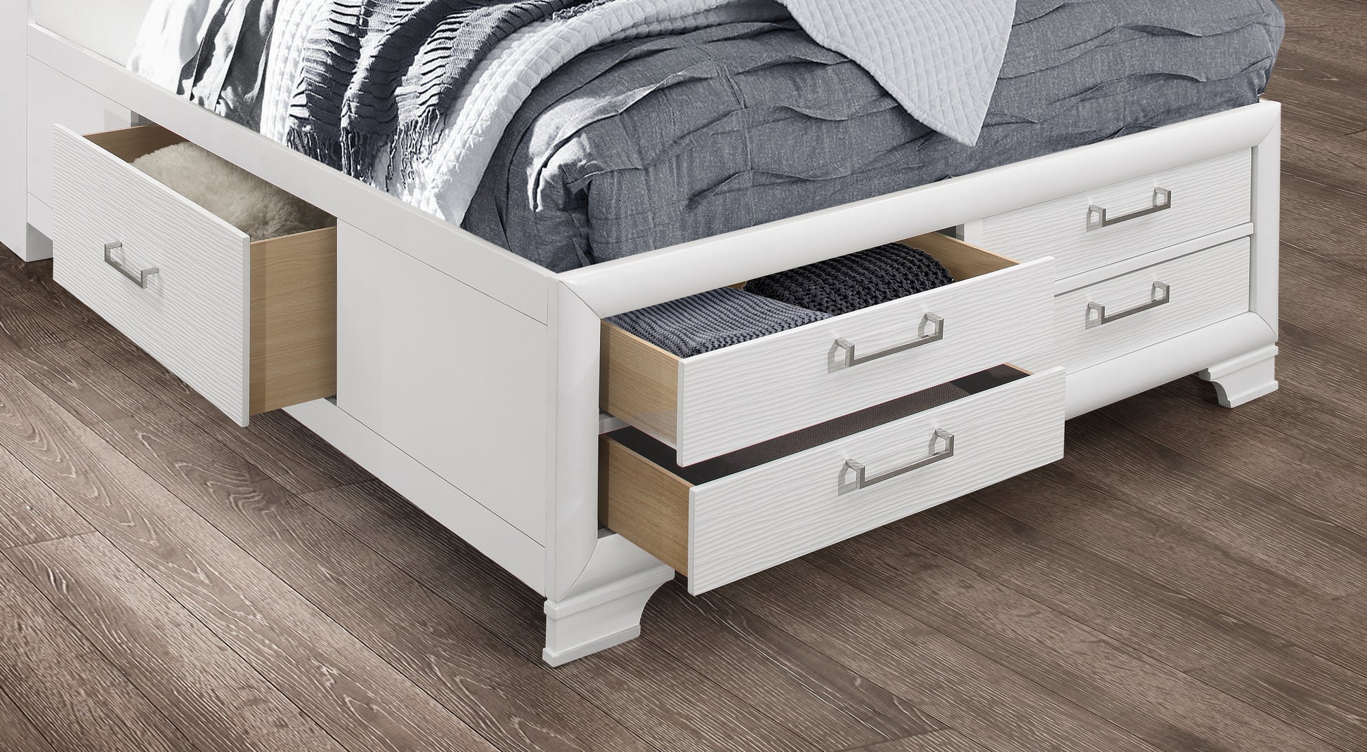 White modern bed frame with two open drawers featuring wood interiors and silver handles