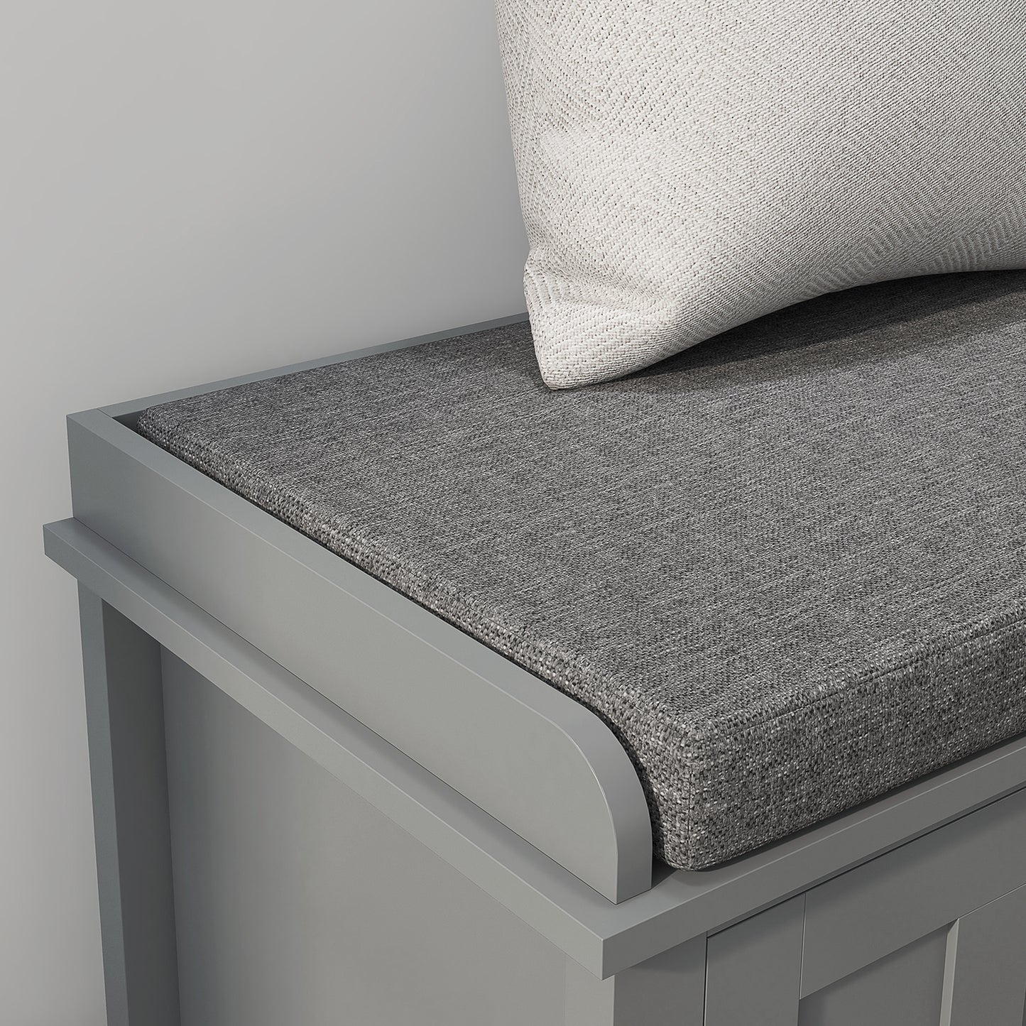 Gray entryway bench with cushioned seat and textured pillow