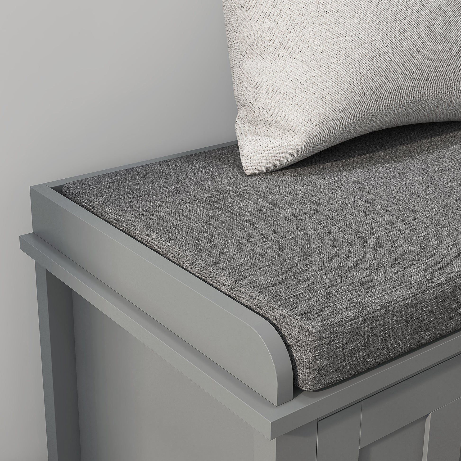 Gray entryway bench with cushioned seat and textured pillow